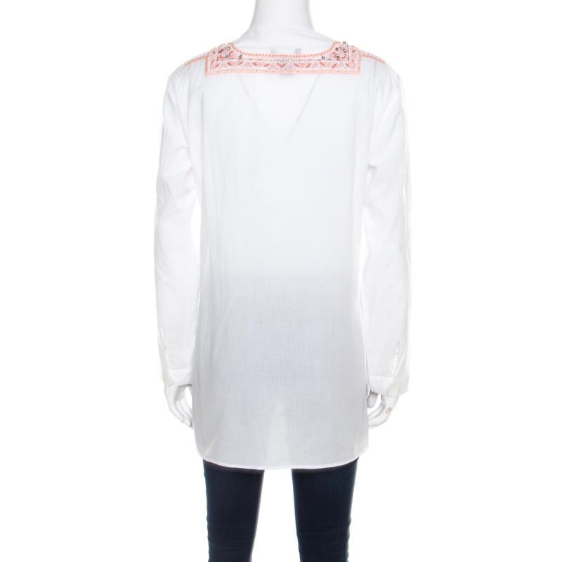 Amazingly stylish is this blouse from Roberto Cavalli. The lovely creation is made of 100% cotton and features a simple silhouette with beautiful embroidery and bead embellishments at the front. It comes with a round neckline and long sleeves. Pair