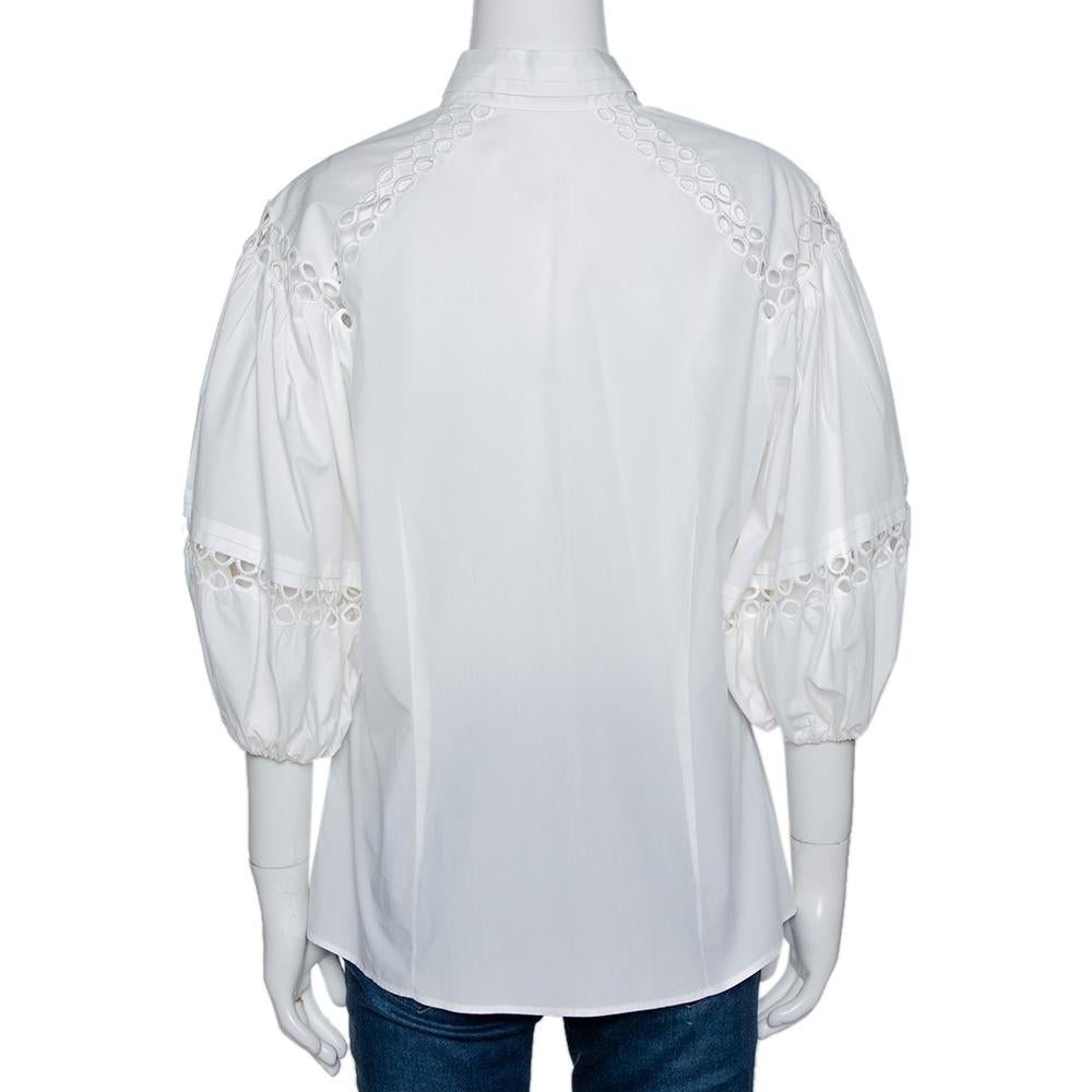 Delicate, comfortable and versatile, this blouse from Roberto Cavalli is a must-have for all the right reasons. Designed to enhance, the cotton blouse has loose sleeves, front buttons and eyelet detailing.

