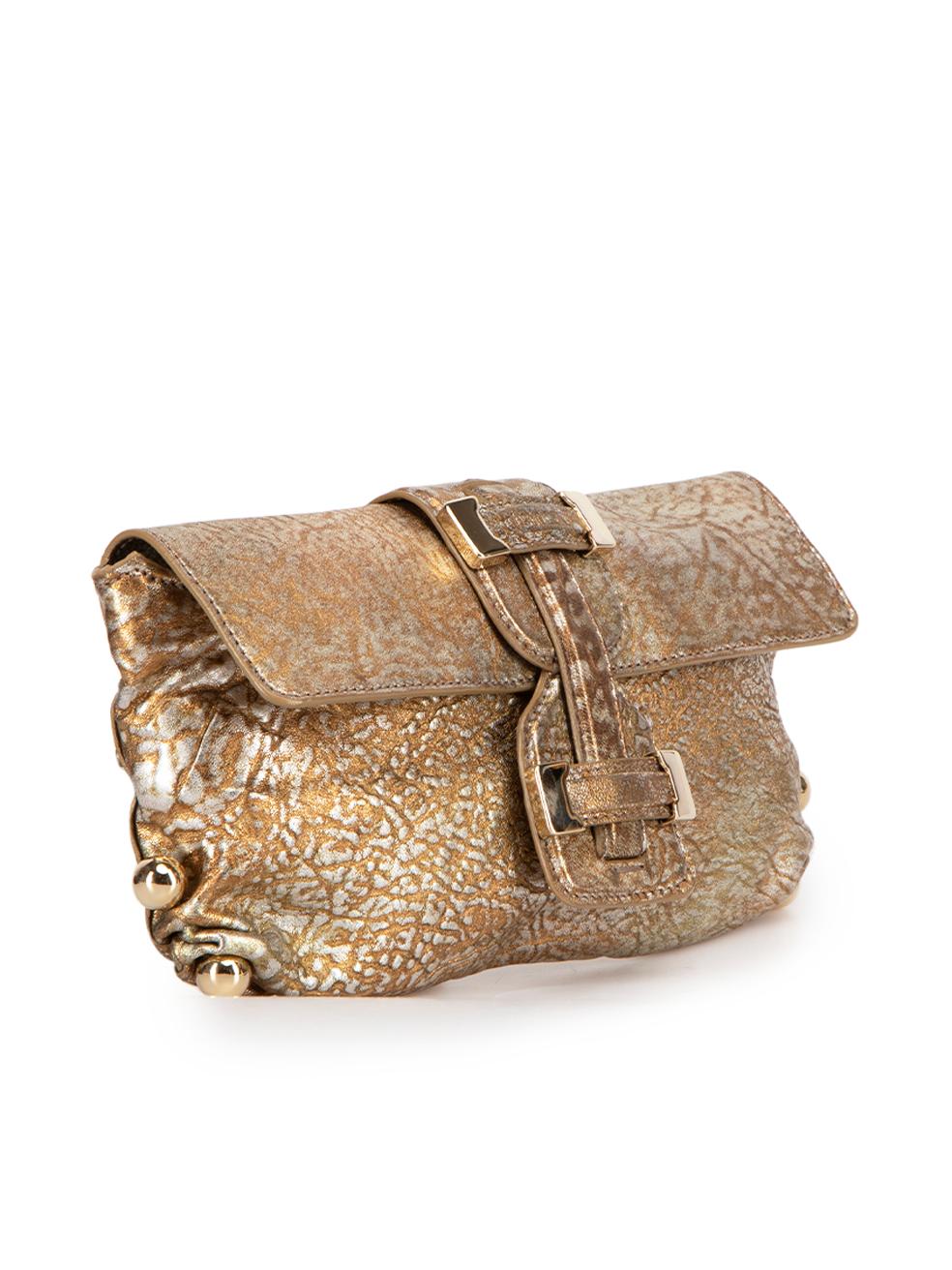 CONDITION is Very good. Minimal wear to clutch is evident. Minimal wear to overall leather on this used Roberto Cavalli designer resale item. Original dust bag is included.



Details


Gold metallic

Leather

Clutch bag

Silver patterned

Gold tone