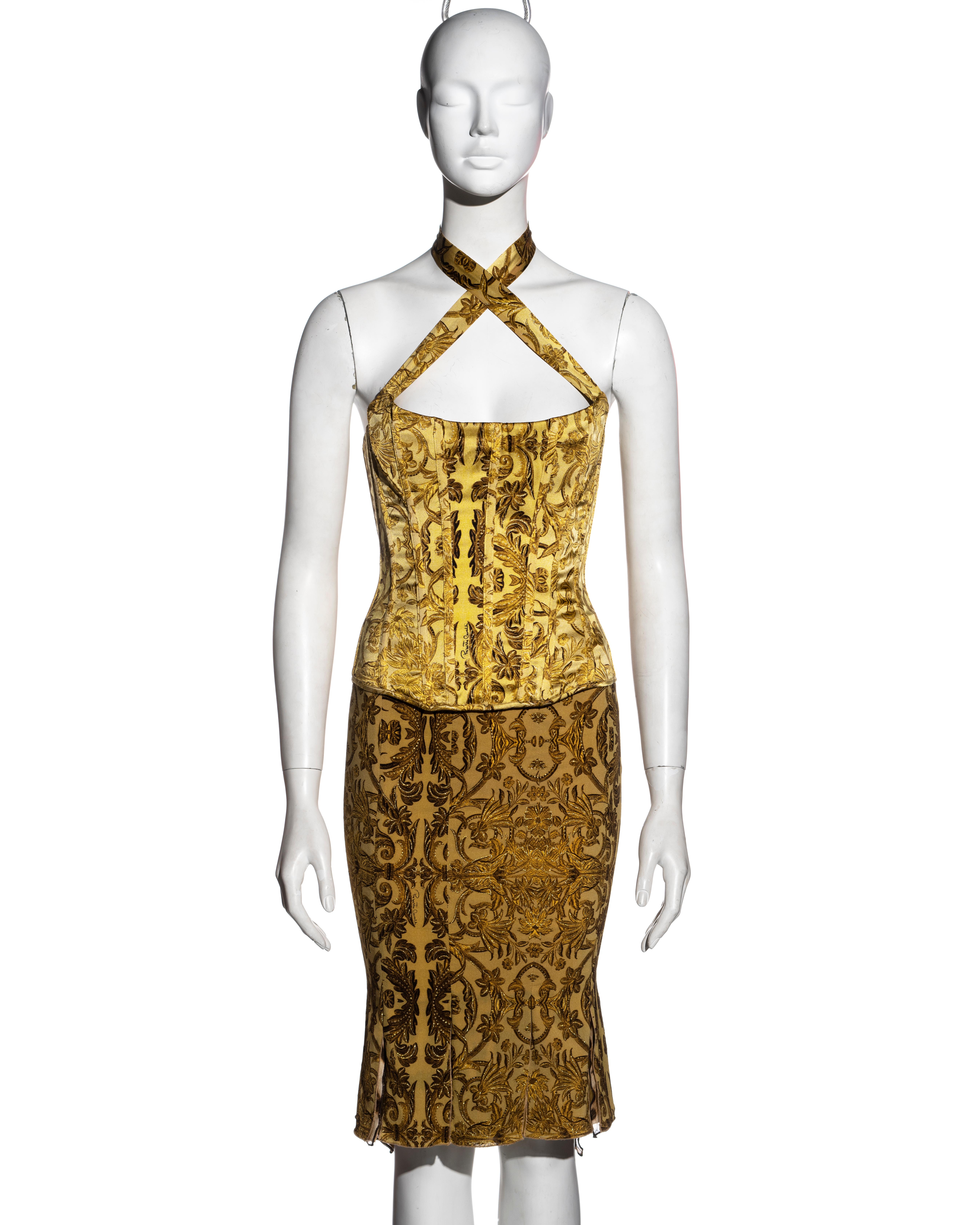 ▪ Roberto Cavalli silk corset and skirt set
▪ Yellow and gold brocade-print  
▪ Corset top with boning and halter-neck straps which criss-cross at the front  
▪ Knee-length skirt with multiple slits and cheetah print underlay  
▪ Size: Small 
▪