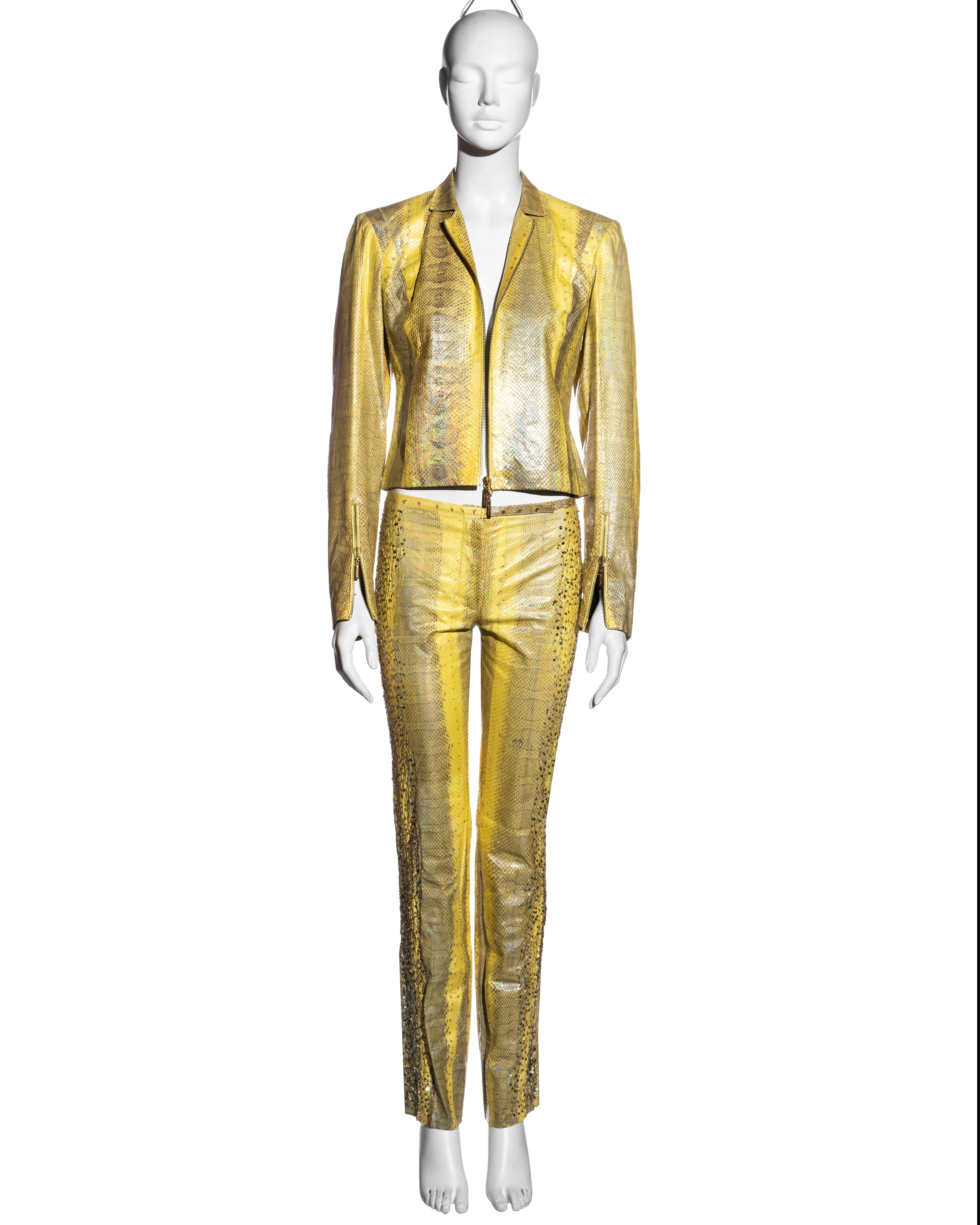 ▪ Roberto Cavalli yellow iridescent snakeskin pant suit
▪ Fitted jacket with double-ended gold zipper
▪ Zip-up cuffs 
▪ Matching slim-fit snakeskin pants with sequin embroidery 
▪ Jacket: Small, Pants: Extra Small
▪ Spring-Summer 2001