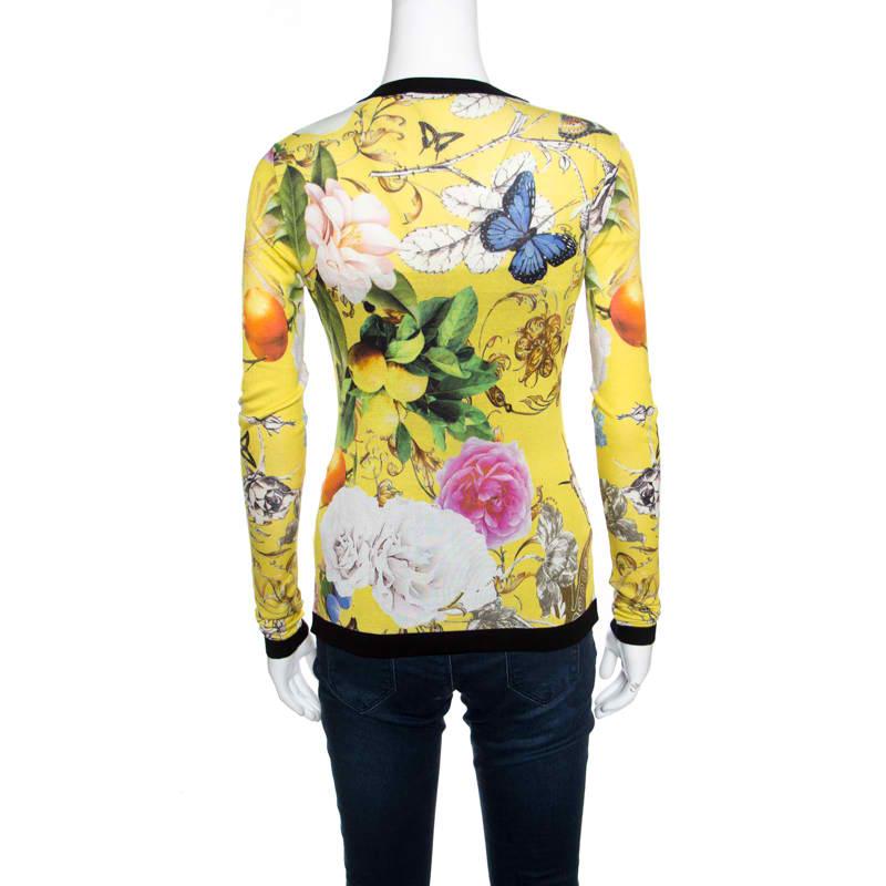 Roberto Cavalli delights us with this wonderful cardigan. It is styled with front buttons, long sleeves, and wonderland prints all over. The yellow cardigan will be a lively addition to your closet.

Includes: The Luxury Closet Packaging

