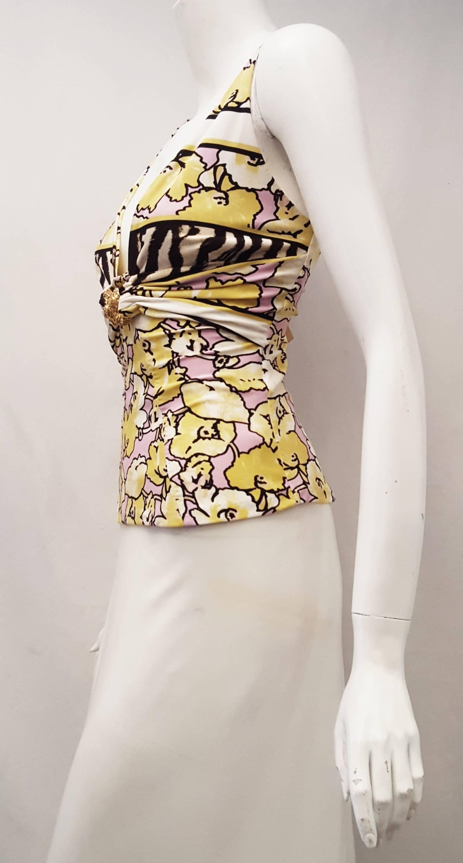 Roberto Cavalli yellow, white and pink floral print fabric and it is not lined.  Two gold tone snake ornament is at the center of the chest uniting the gathered fabric under the bust.  This top is not lined and is in excellent condition.   This