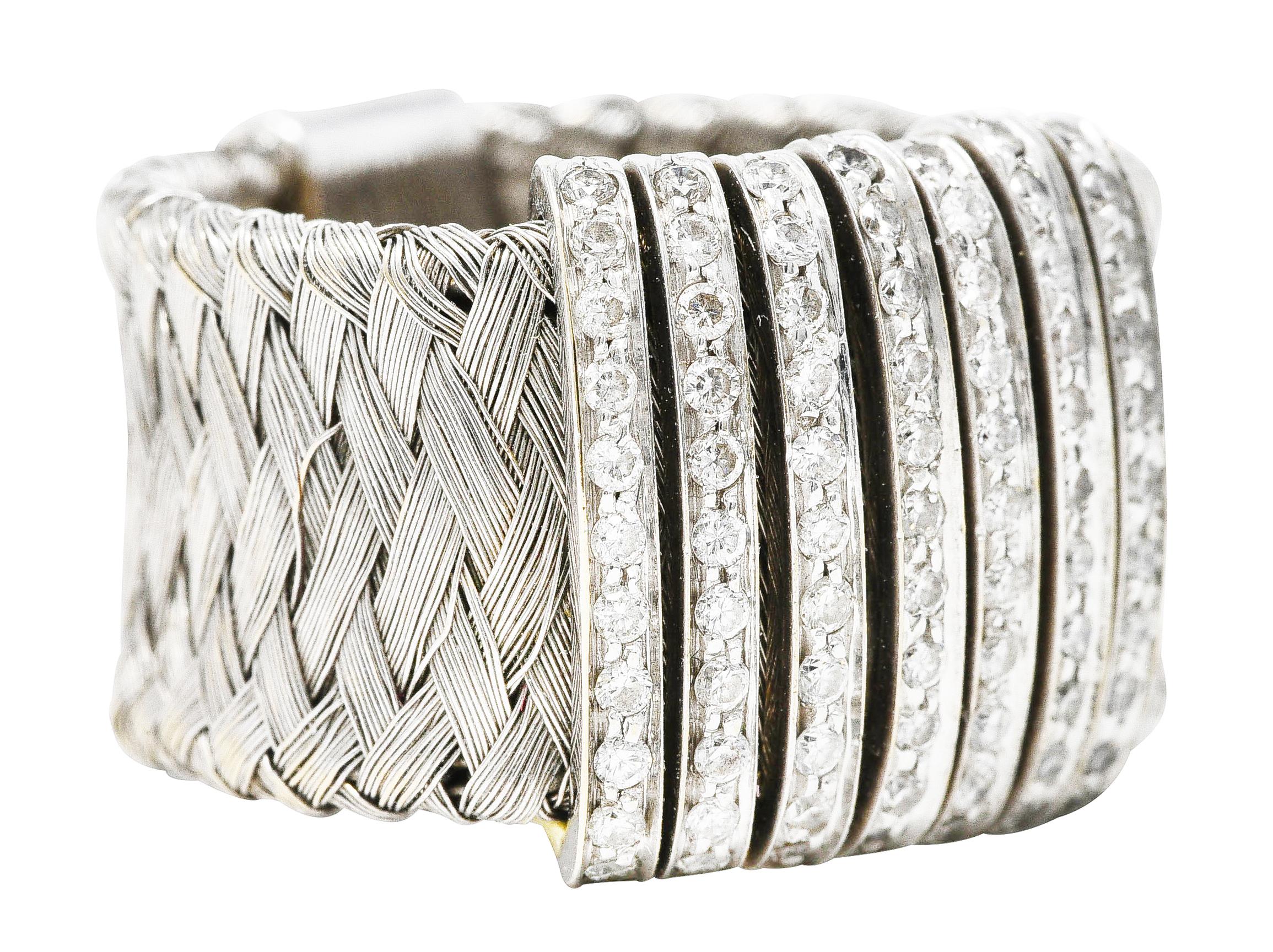 Malleable band ring is comprised of finely woven white gold. Strung with seven bar stations - bead set with round brilliant cut diamonds. Weighing in total approximately 0.80 carat with G/H color and SI clarity. Terminates as a white gold bar at