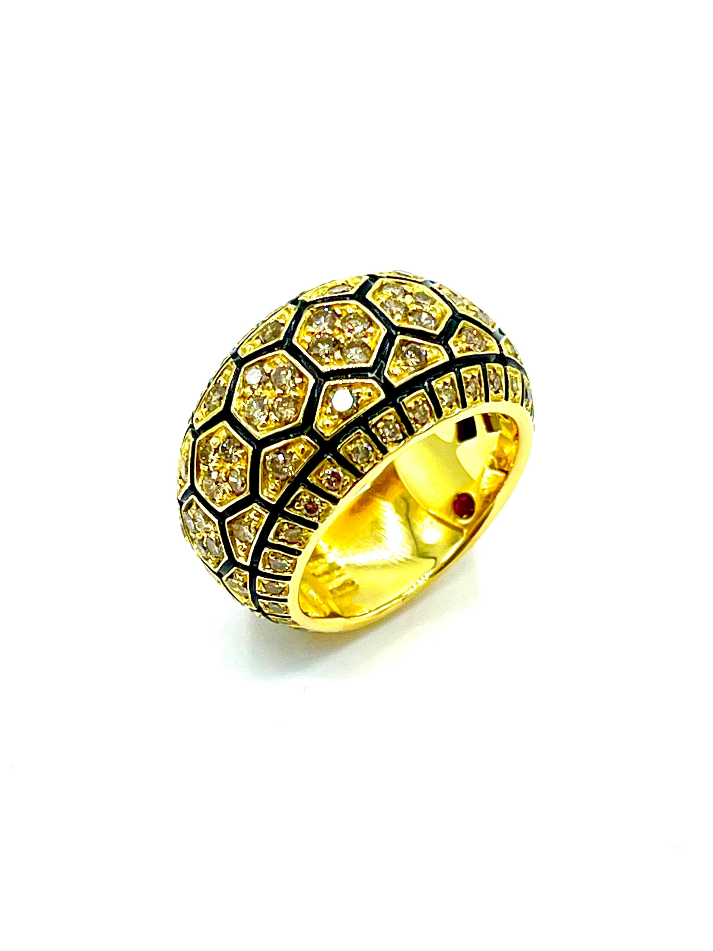 This is a fabulous ring by iconic designer Roberto Coin!  The geometric design of the ring is highlighted by 1.05 carats in round brilliant champagne Diamonds set in 18K yellow gold, with black enameling in the channels between the Diamond stations.