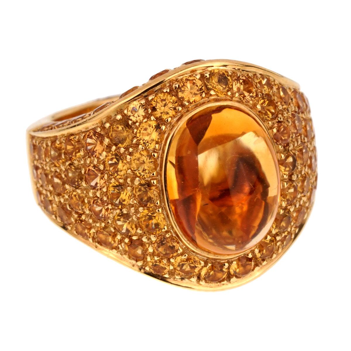 A fabulous Roberto coin ring in 18k yellow gold oval citrine cabochon 6.30ct appx and 4.6 carats of round brilliant cut citrine. The ring measures a size 7 and can be resized.