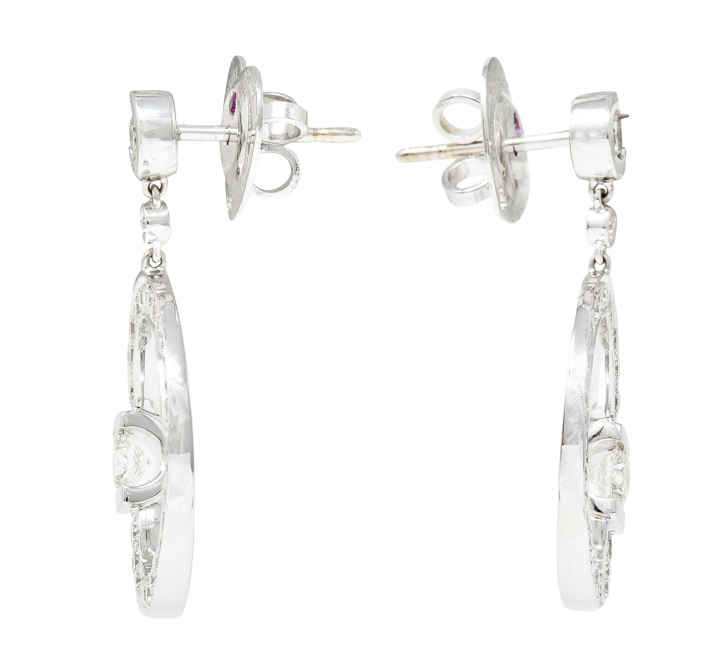 Earrings are designed as white gold 'C' motif surmounts suspening 'C' motif circle drops. With round brilliant and Cento cut diamonds bezel, bead and tension set throughout. Roberto Coins signature Cento cut is a 100 facet brilliant cut. Weighing