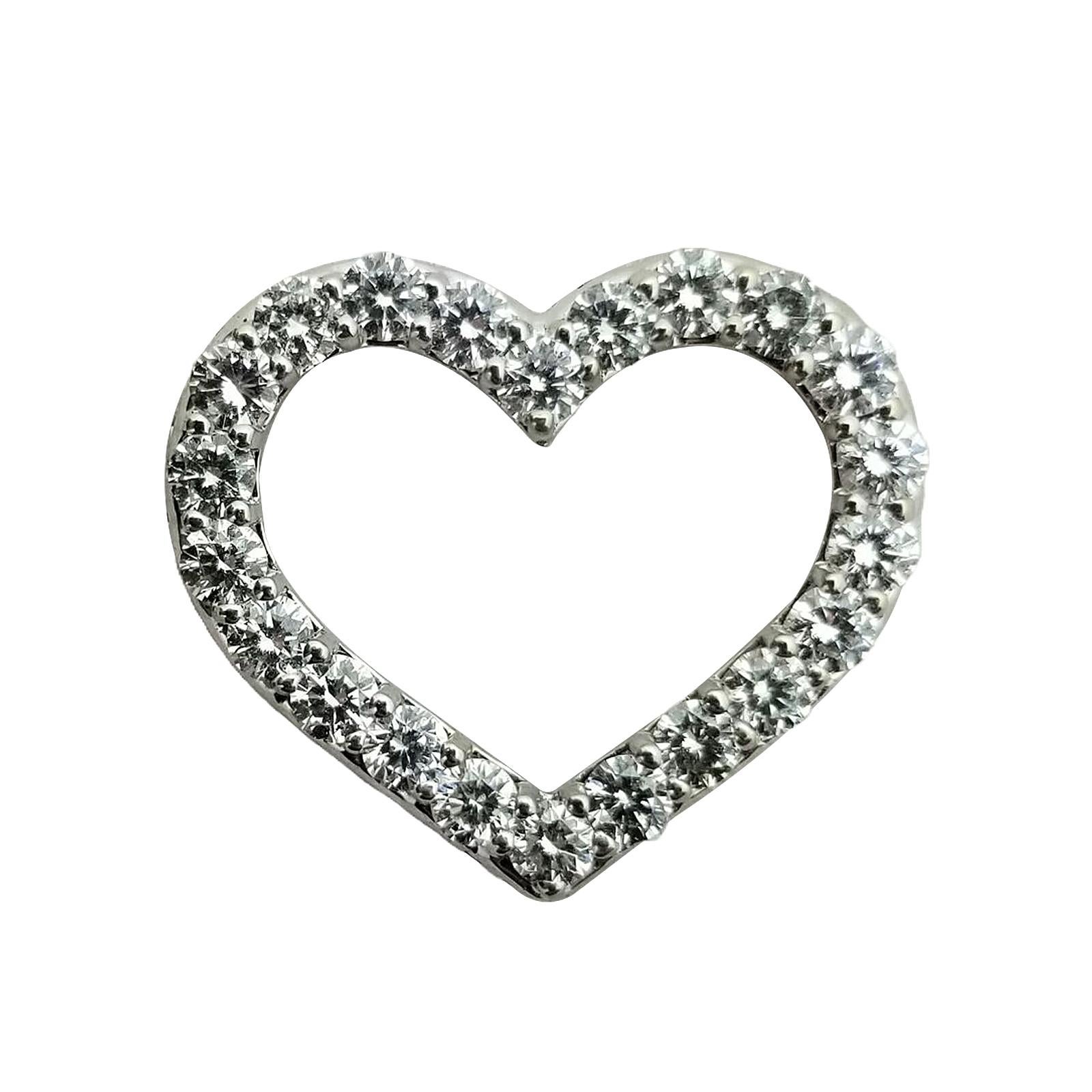 Open Hart Diamond Pendant Necklace 18K White Gold by Roberto Coin. This is a piece for every personality. This beautiful diamond open heart pendant by designer Roberto Coin features 22 round brilliant cut diamonds graded G/H color and VS2 clarity.
