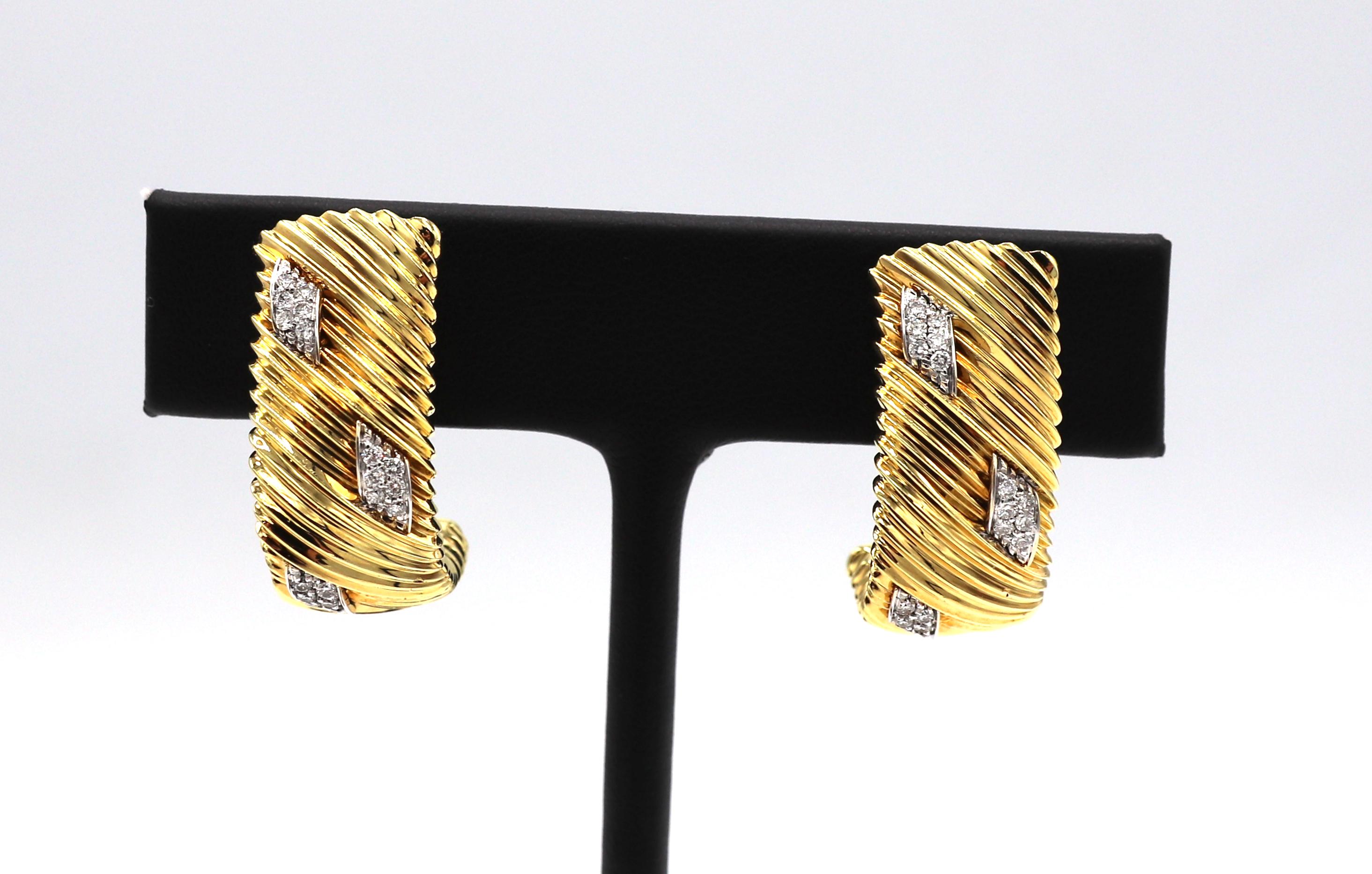 Roberto Coin 18 Karat Gold Diamond Half Hoop Earrings 
Metal: 18 karat yellow & white gold
Weight: 20.9 grams
Diamonds: Approx. .54 CTW G-H VS
Length: 26.5mm
Width: 11mm
Signed: ROBERTO COIN 