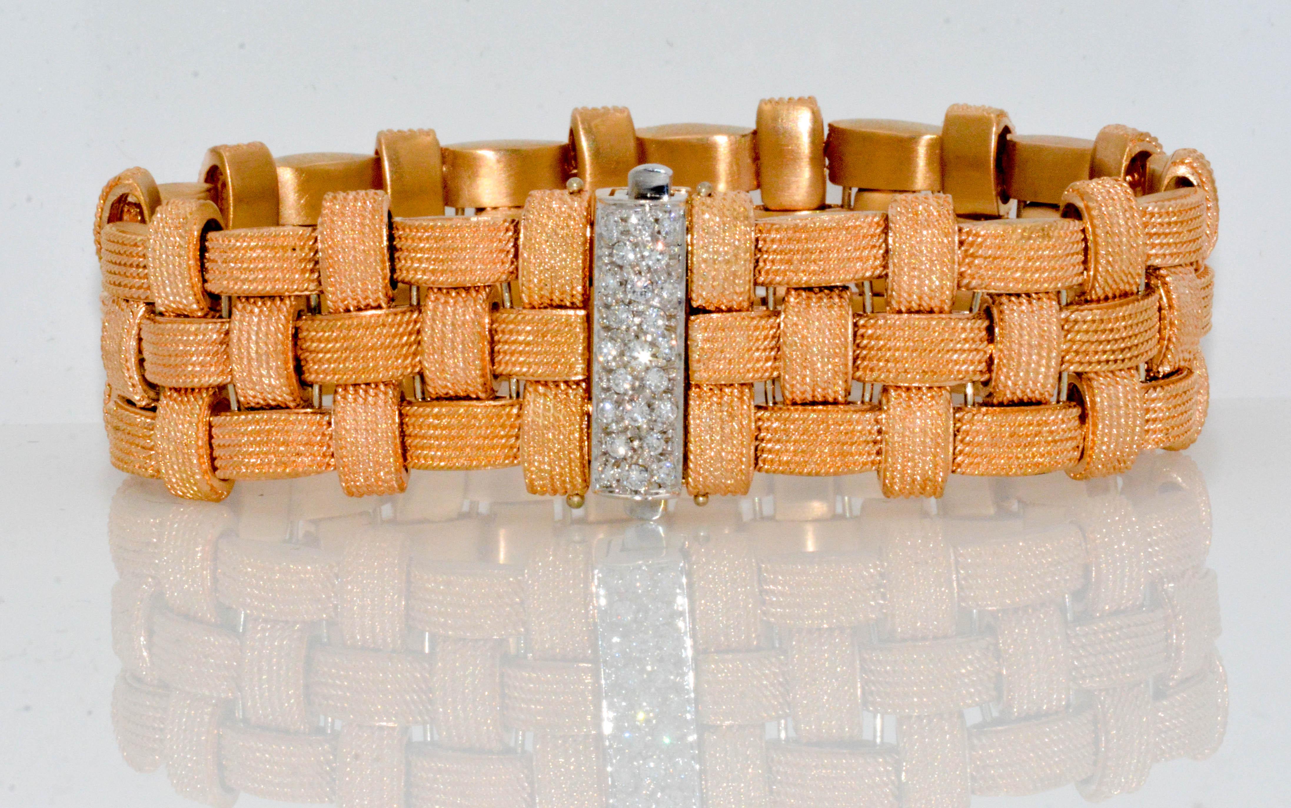 Our elegant 18 karat rose gold Roberto Coin bracelet is the perfect choice for festivities day through evening with it's 3 rows of woven rose gold that feels like it's worth a million. This Italian design is luxurious adorned with an 18 karat white