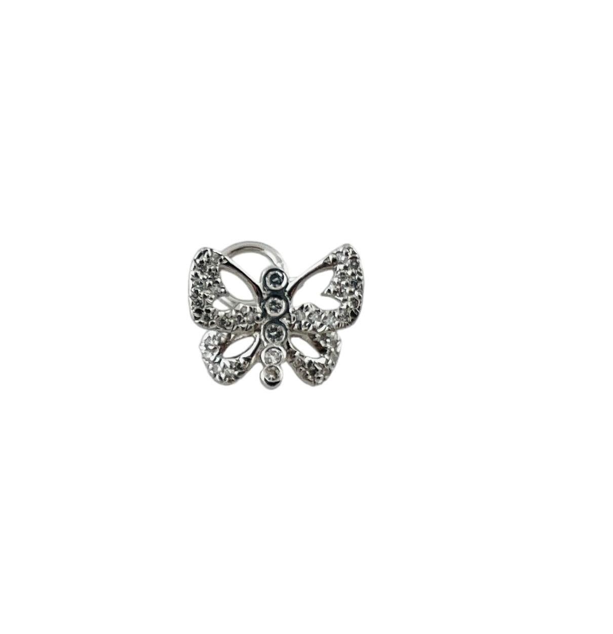 Roberto Coin 18 Karat White Gold and Diamond Butterfly Pendant-

This sparkling butterfly charm features 37 round brilliant cut diamonds set in classic 18K white gold. Roberto Coin trademark ruby on back.

Approximate total diamond weight: .38
