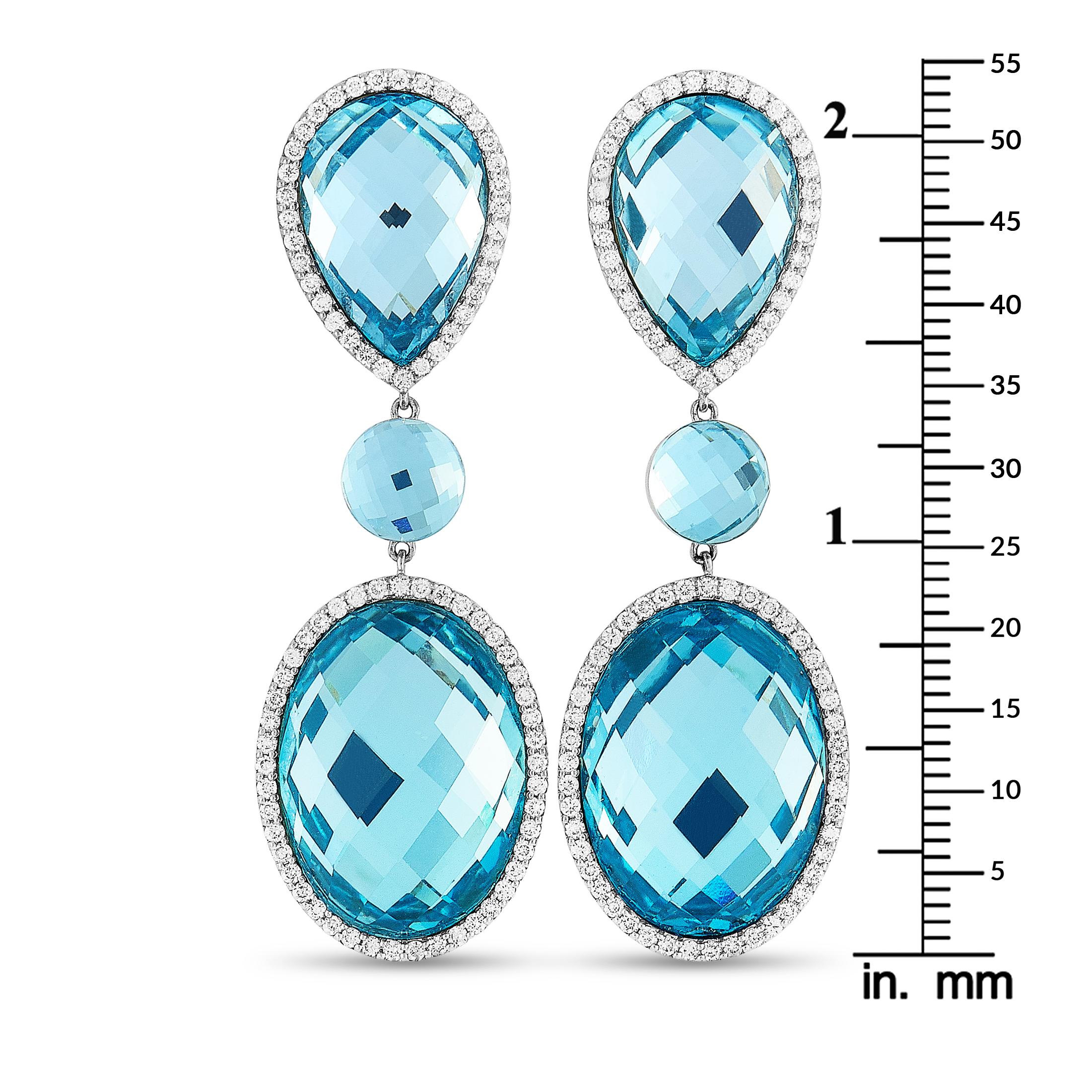 These Roberto Coin earrings are made of 18K white gold and each weighs 12.25 grams, measuring 2.20” in length and 0.75” in width. The earrings are set with diamonds and topazes that total 1.32 and 30.00 carats respectively.

Offered in brand new