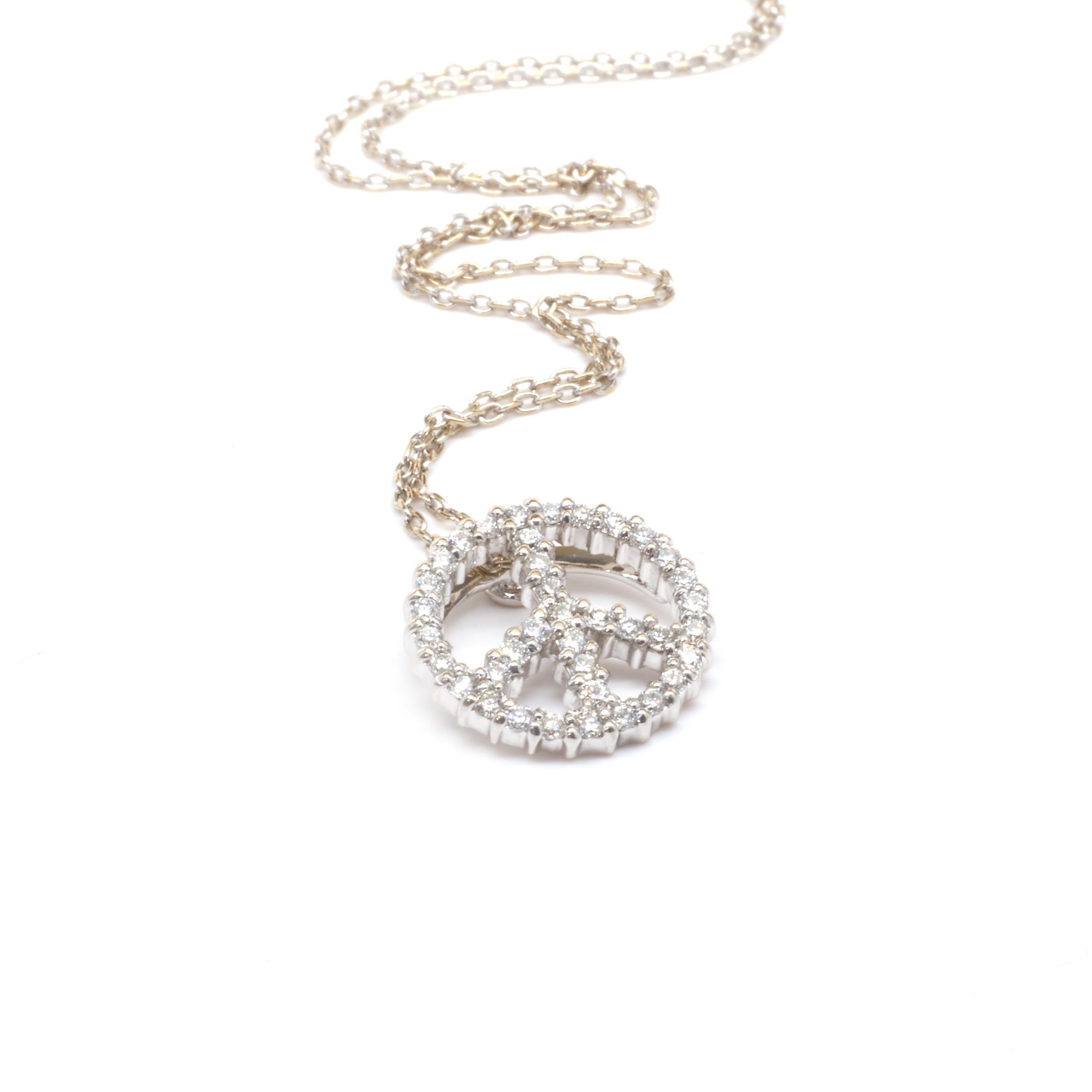 Designer: Roberto Coin 
Material: 18 karat white gold
Diamonds: 38 round cut = .18cttw
Color: G
Clarity: VS2
Weight: 2.55 grams
