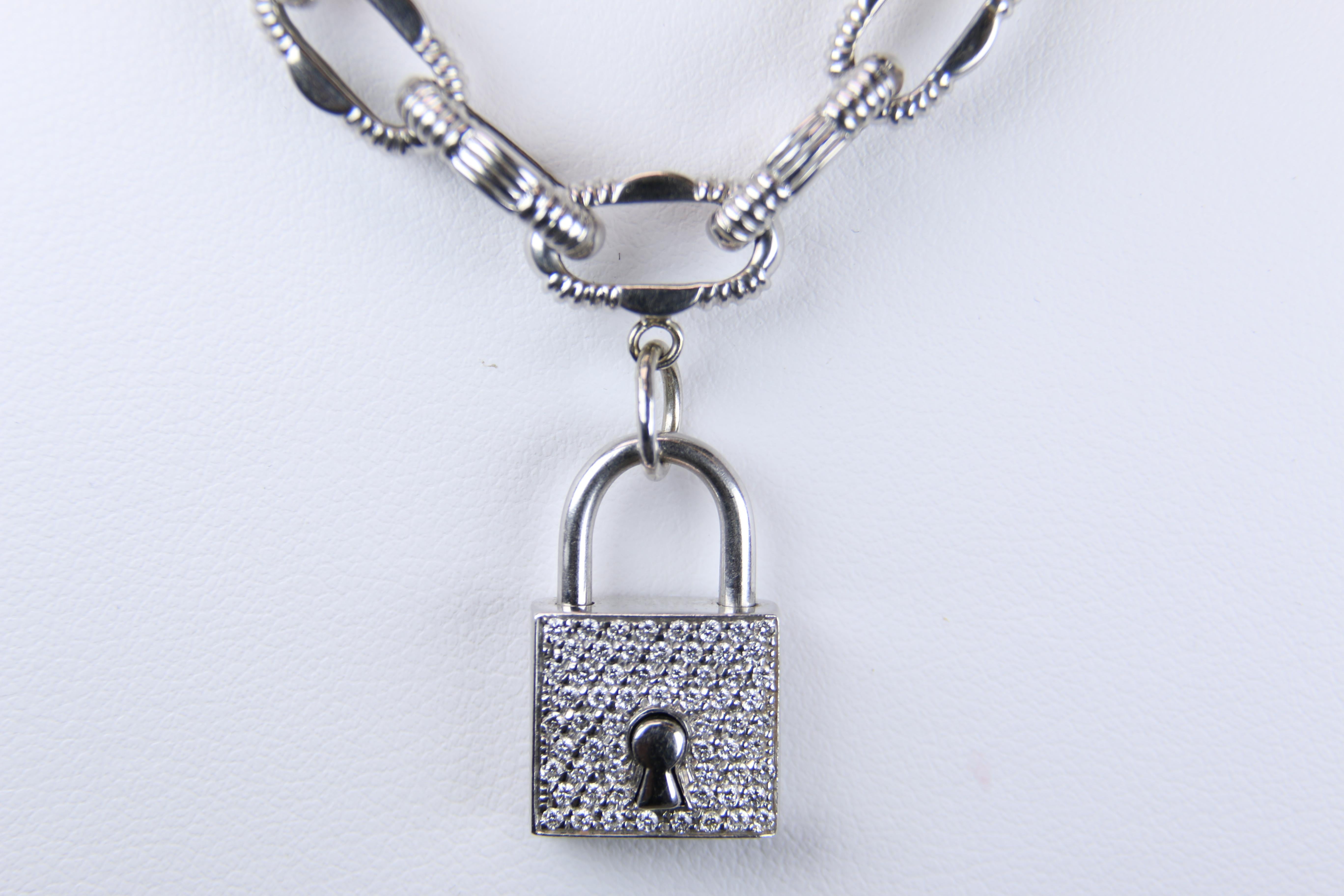Roberto Coin 18K White Gold Diamond Padlock Link Necklace from the Appassionata Collection is 18 inches in length and consist of ornately designed open links. Each link is approximately 1/4 inch wide making a bold statement further accentuated by a