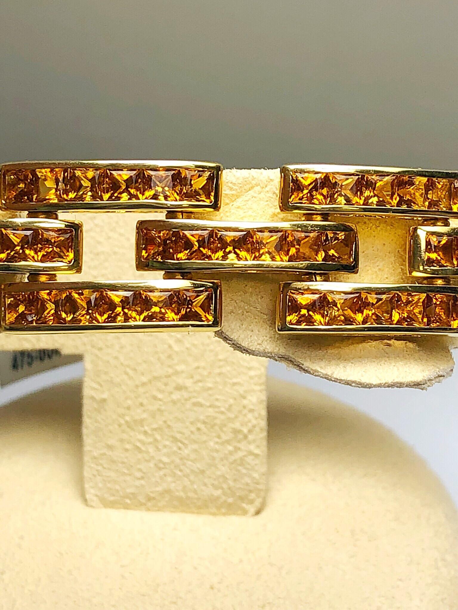 Chic and Beautiful, this 3 row panther link bracelet is invisibly set with princess cut citrines. Each link has 6 stones, expertly set by Roberto Coin. 
Measuring 7.5'' long and 0.5'' wide
