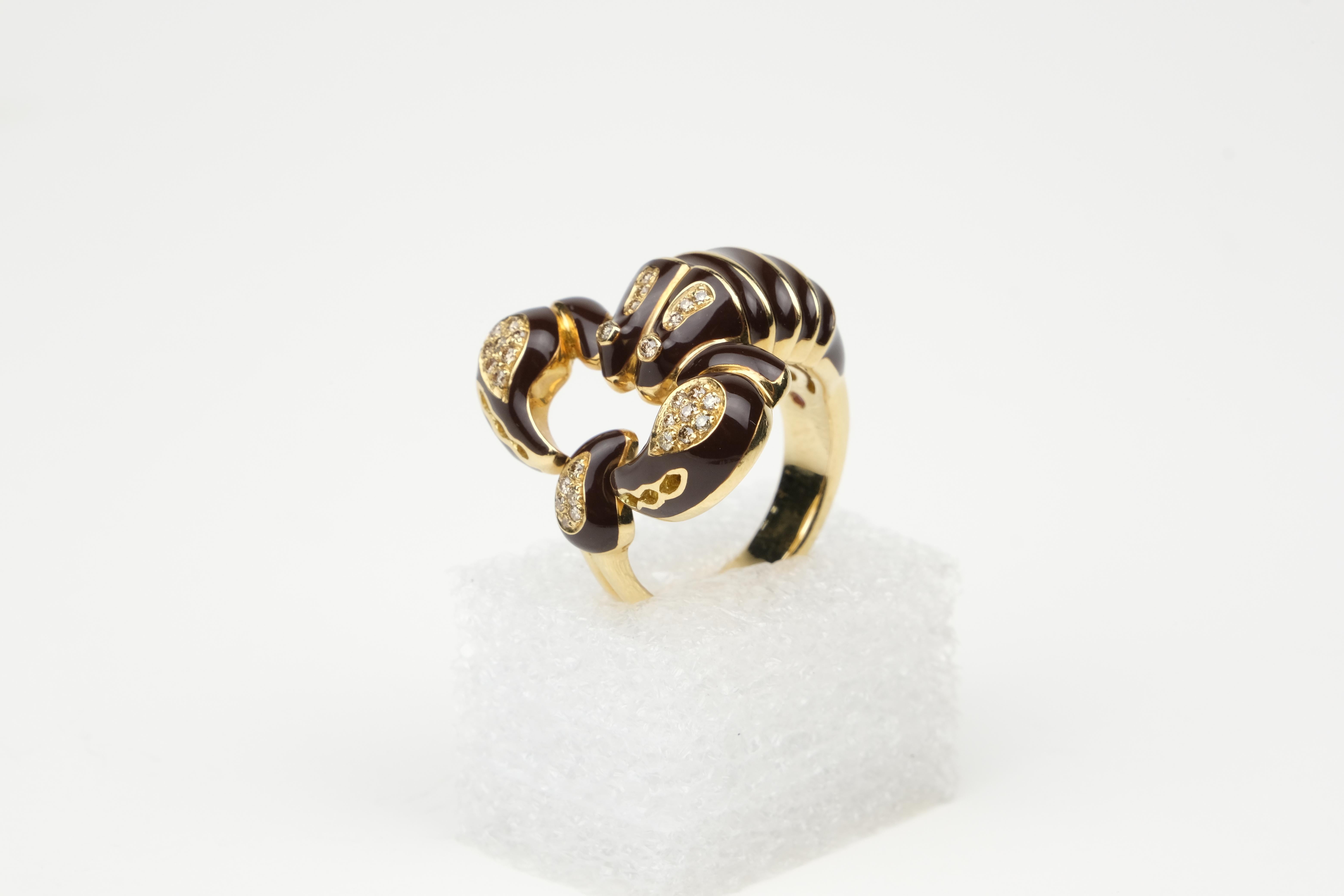 Roberto Coin 18K Diamond and Enamel Scorpion Ring

Ok, this ring is just plain cool. You don’t have to be a Scorpio to like scorpions, especially this one.

It is from the Roberto Coin Animalier collection and rendered in 18k gold with black