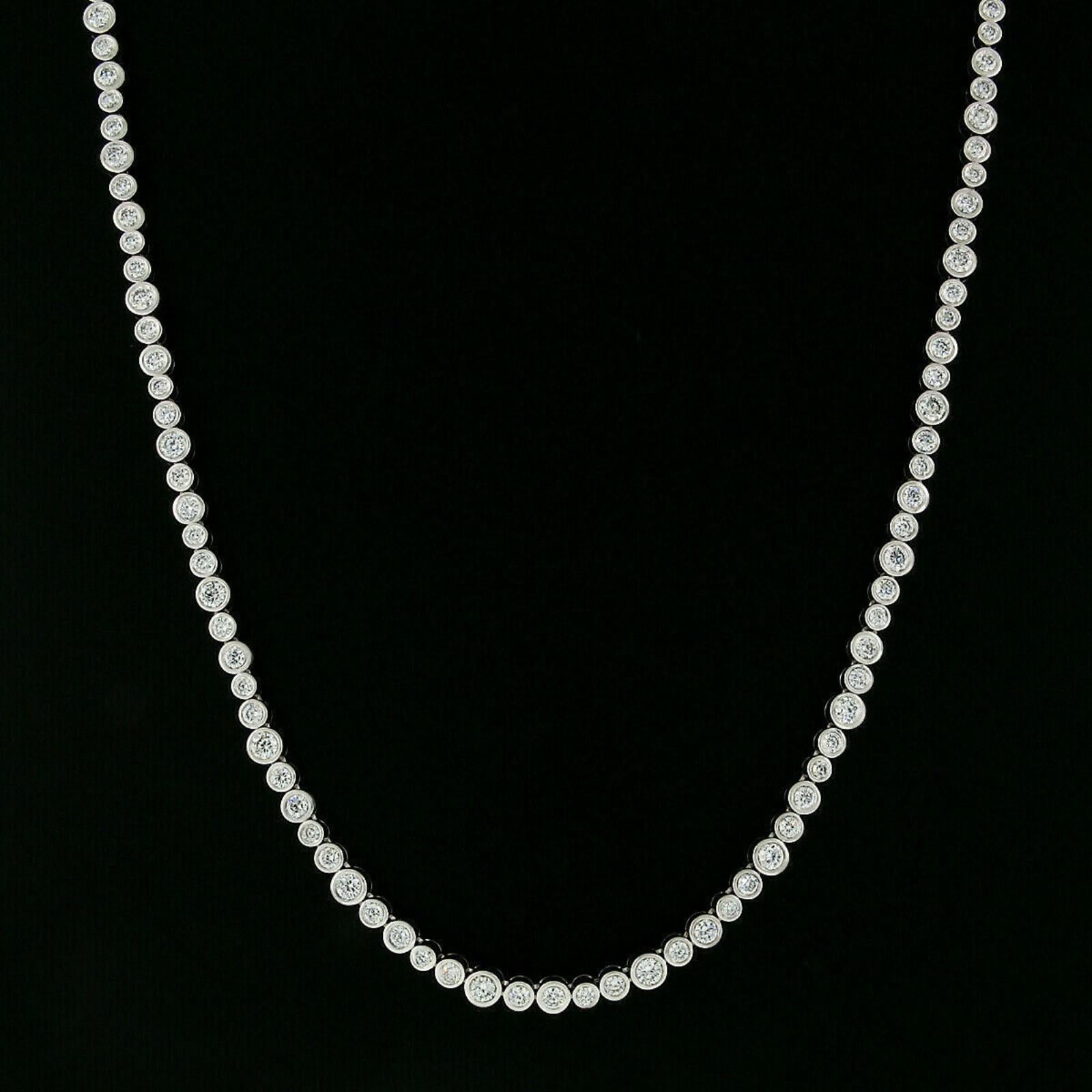 This absolutely breathtaking diamond tennis necklace is designed by Roberto Coin and crafted in Italy from solid 18k white gold. It features 88 super FINE quality round brilliant, CENTO cut diamonds. The signature CENTO diamond has 100 facets rather