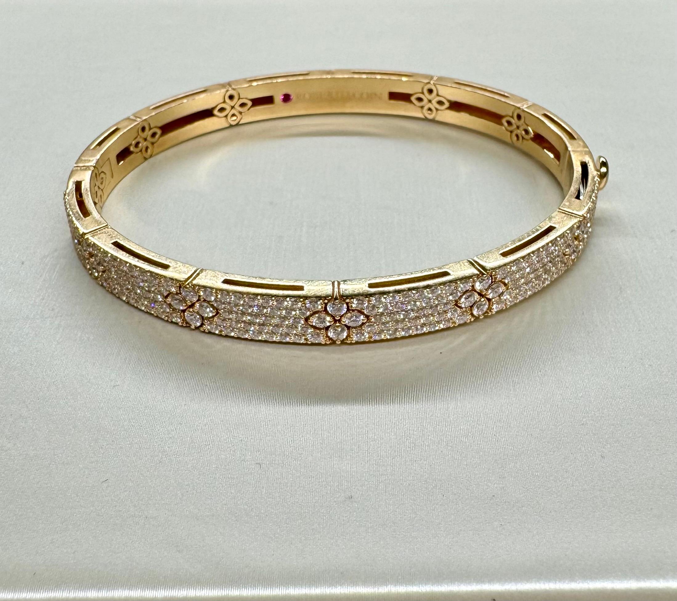 
Indulge in timeless elegance with the Roberto Coin 18K Rose Gold Diamond Love in Verona Bangle, a mesmerizing blend of sophistication and romance. Crafted from luxurious 18k rose gold and stamped for authenticity, this exquisite bangle bears the