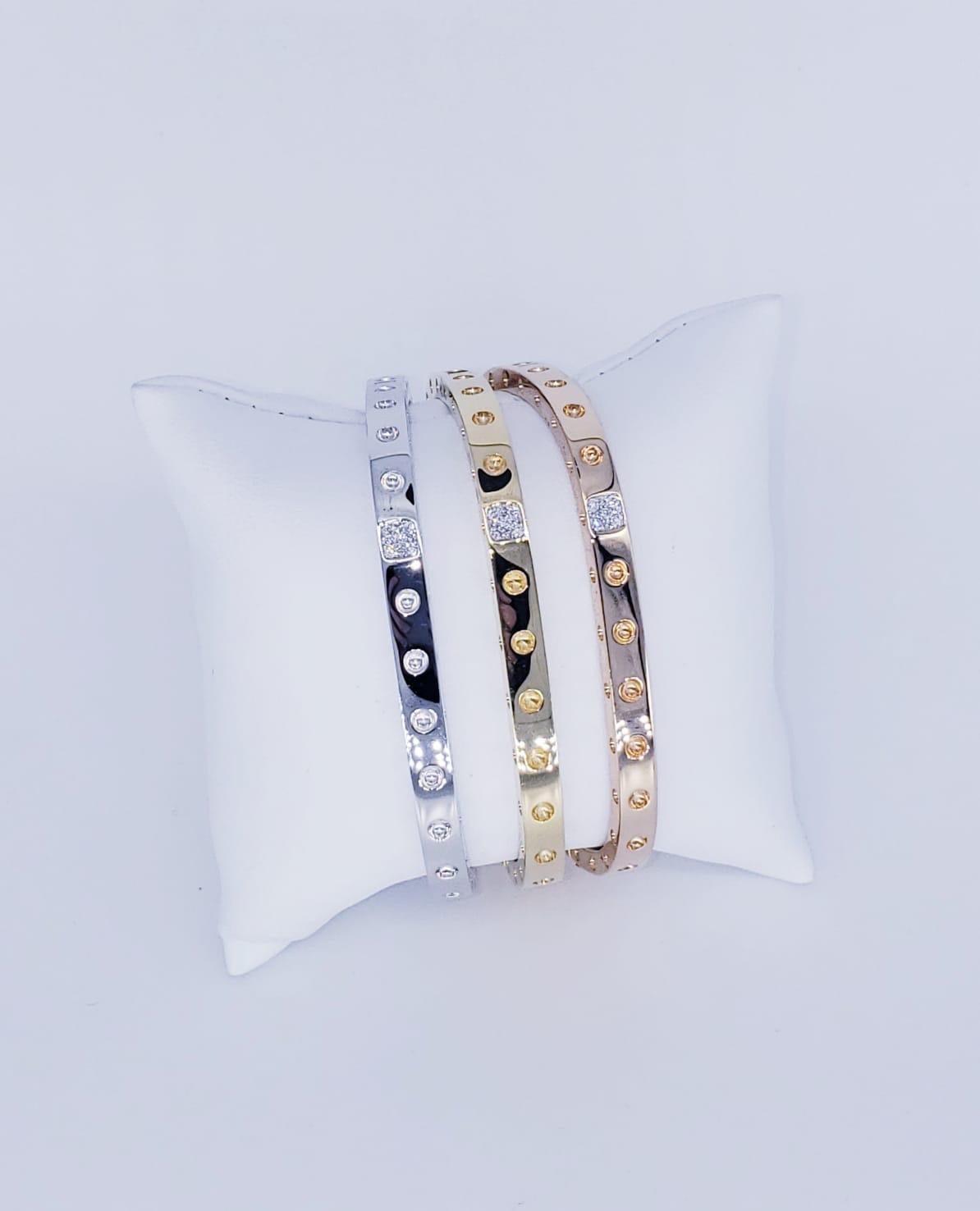 Roberto Coin 18k Tri-Gold Square Bangle Set With Diamonds. Gorgeous bangles featuring hinges push-lock clasp. The diamonds for the set is approx 0.21 and ruby in each bangle in the inside. The bangles are from the Pois Moi collection by Roberto
