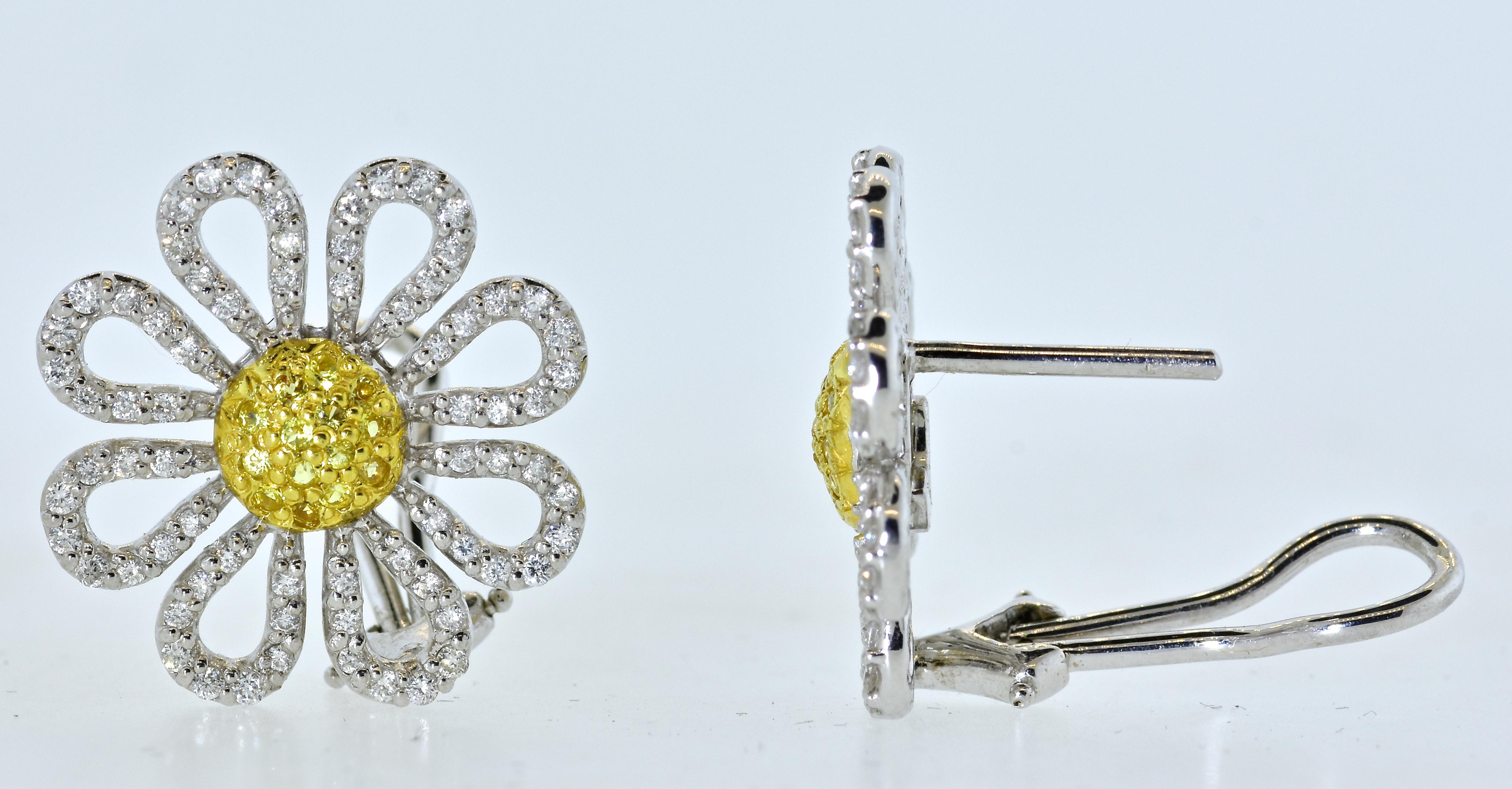 Roberto Coin's daisy motif earrings composed of 28 natural fancy intense/vivid yellow brilliant cut diamonds  and 144 white brilliant cut diamonds all near colorless (H), and very slightly included.  The estimated diamond weight is 1.75 cts.  The