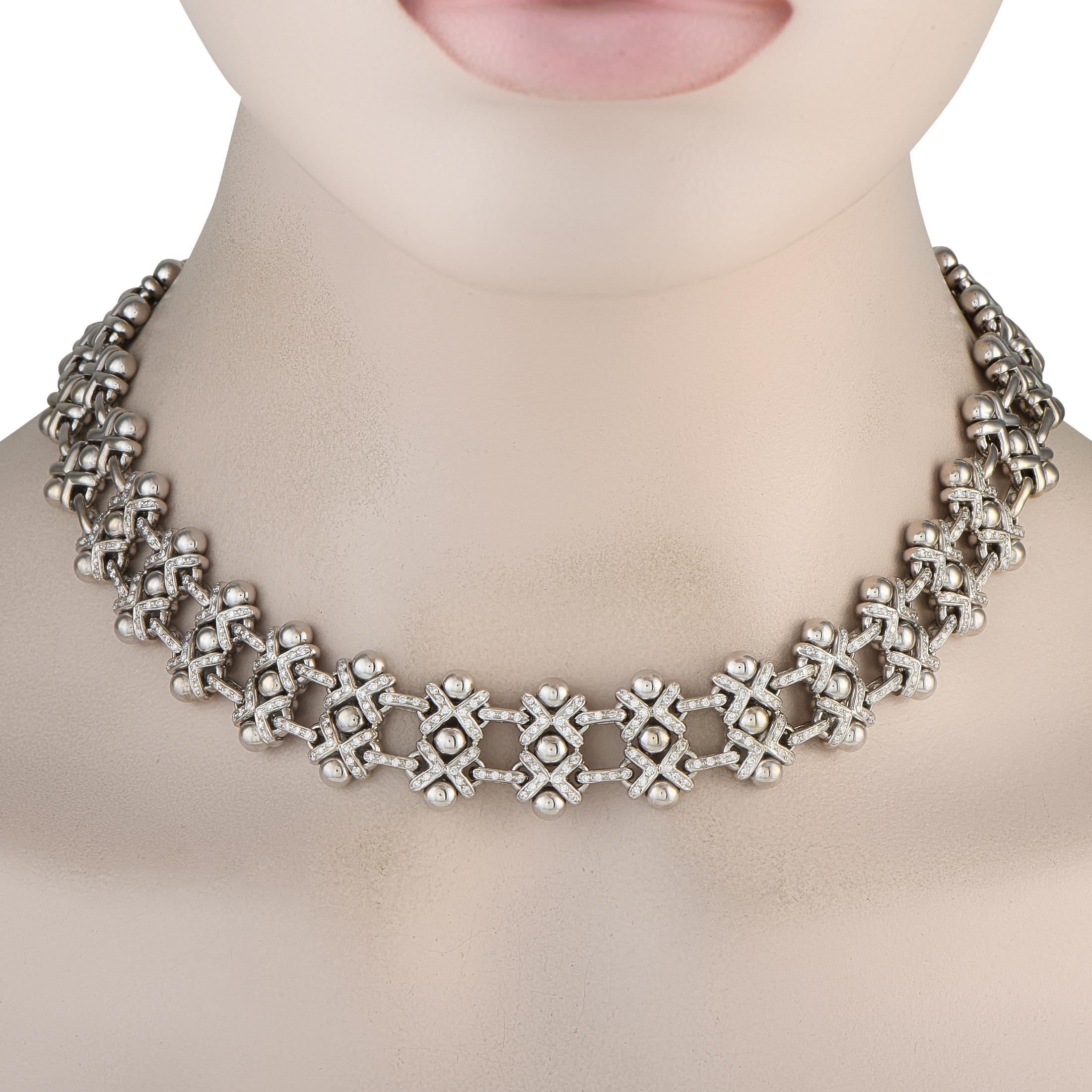 This Roberto Coin necklace will continually make a statement. Crafted from 18K White Gold, the metalwork details come together to create a beautiful basket weave pattern. Inset Diamonds totaling 0.95 carats put the perfect finishing touch on this