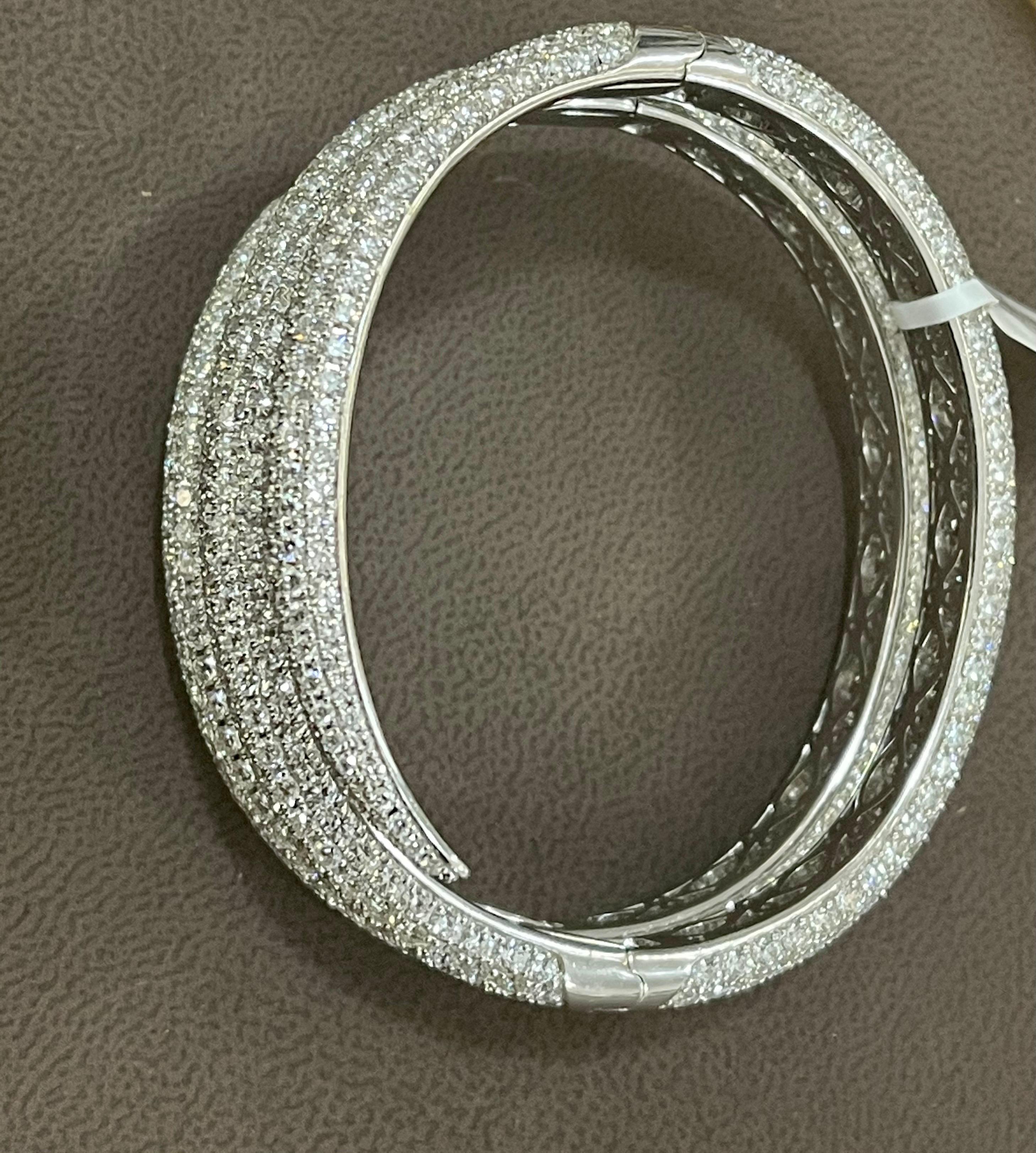 ROBERTO COIN 18K WHITE GOLD DIAMOND WRAP AROUND BANGLE BRACELET 
Out of this world Piece
 A statement of true, classic elegance, this 18k Roberto Coin Bangle Bracelet with Pave Diamond  from his signature collection. 
This makes for a very