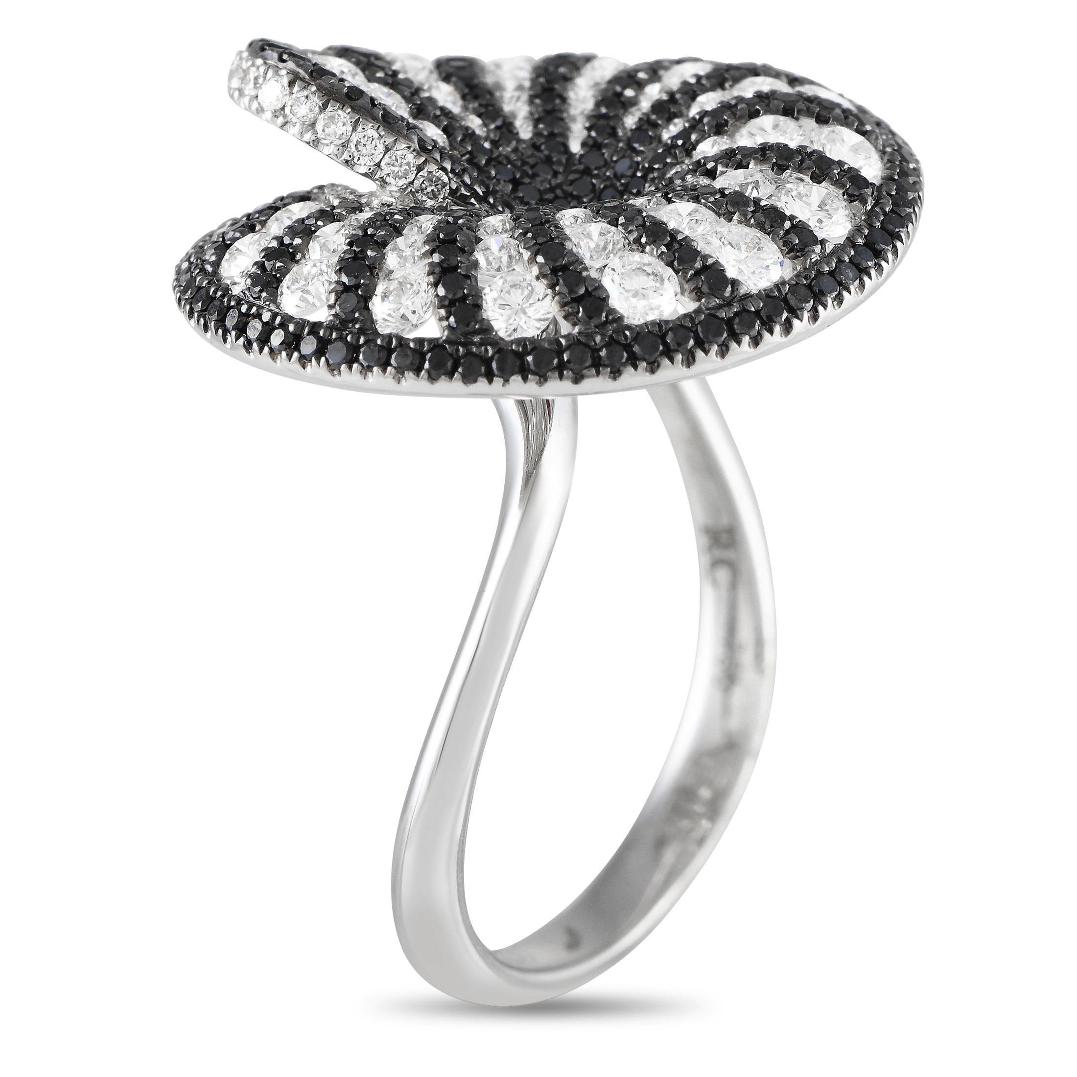 This delicate Roberto Coin ring is nothing short of breathtaking. White Diamonds totaling 1.25 carats and Black Diamonds totaling 1.10 carats are beautifully juxtaposed on this rings uniquely elegant 18K White Gold setting. Impeccably crafted and