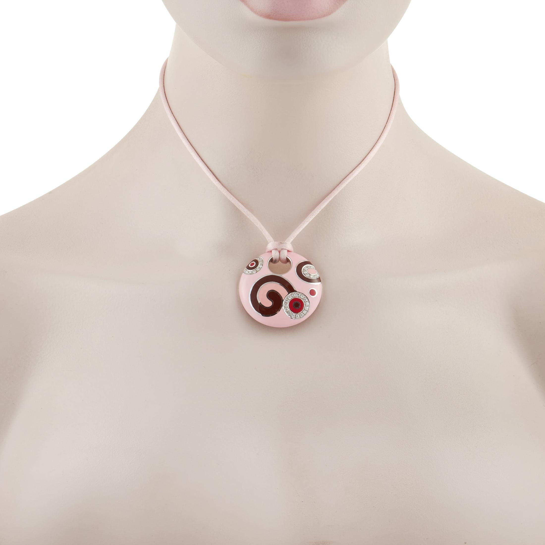 This creative pendant necklace from Roberto Coin has a decidedly artistic point of view. The round pendant measures 1.5” round and comes to life thanks to colorful enamel, sparkling diamonds, and 18K White Gold accents. It’s attached to a pink cord