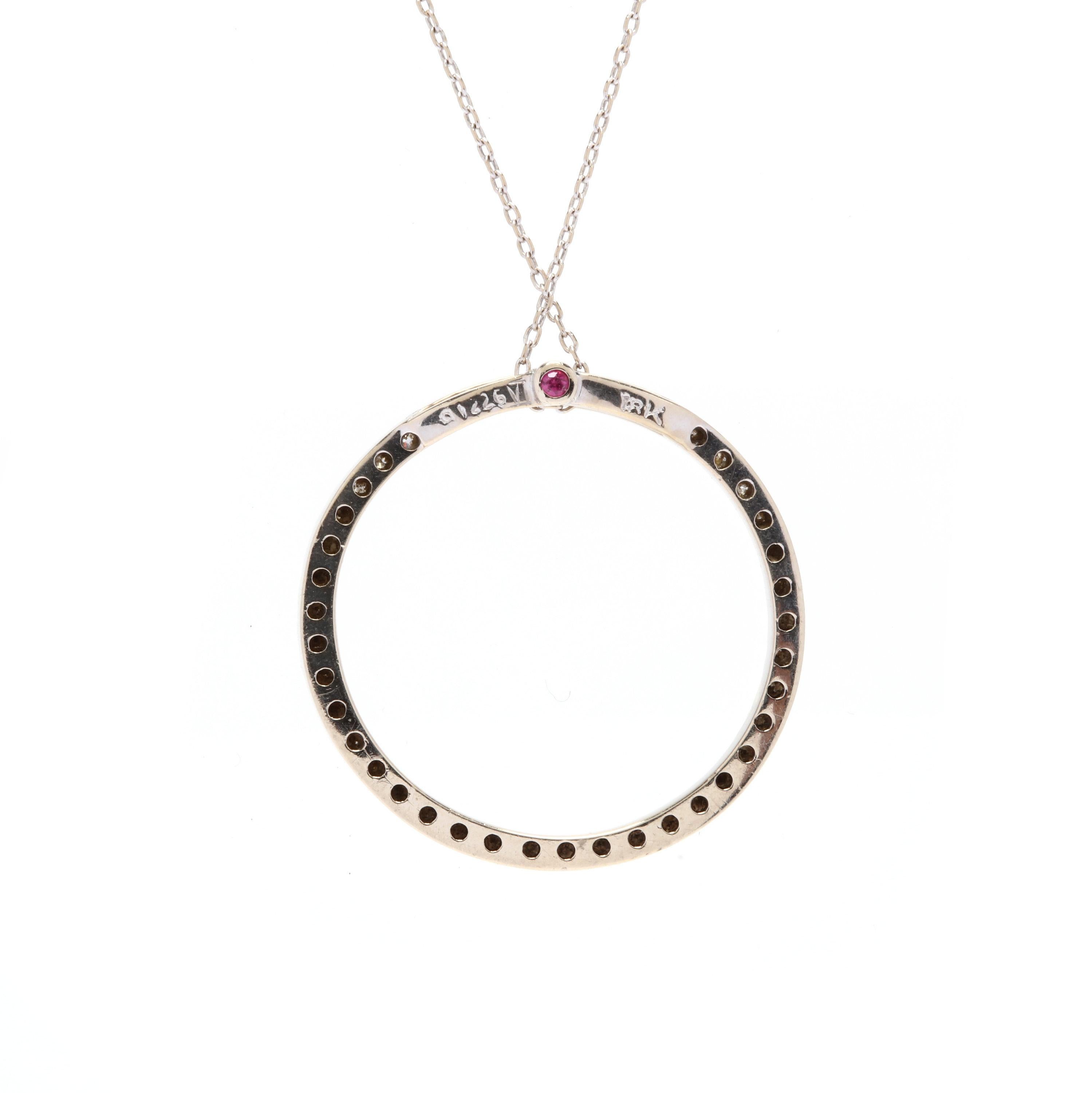 Roberto Coin 18k white gold, diamond & ruby circle pendant necklace. A timeless look by well-known designer Roberto Coin, you can't go wrong with a diamond eternity pendant. A dainty ring of diamonds with his trademark ruby set on the back of the