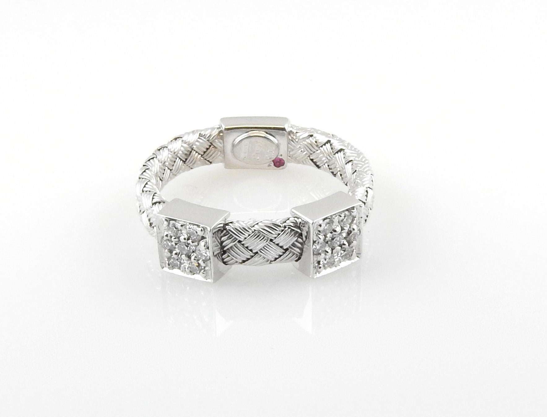Roberto Coin 18K White Gold Primavera Diamond Basket Weave Band Size 6.5

This beautiful cable band is set in white gold and has two square diamond stations. 

Each diamond station is set with 7 round brilliant diamonds of VS clarity and G