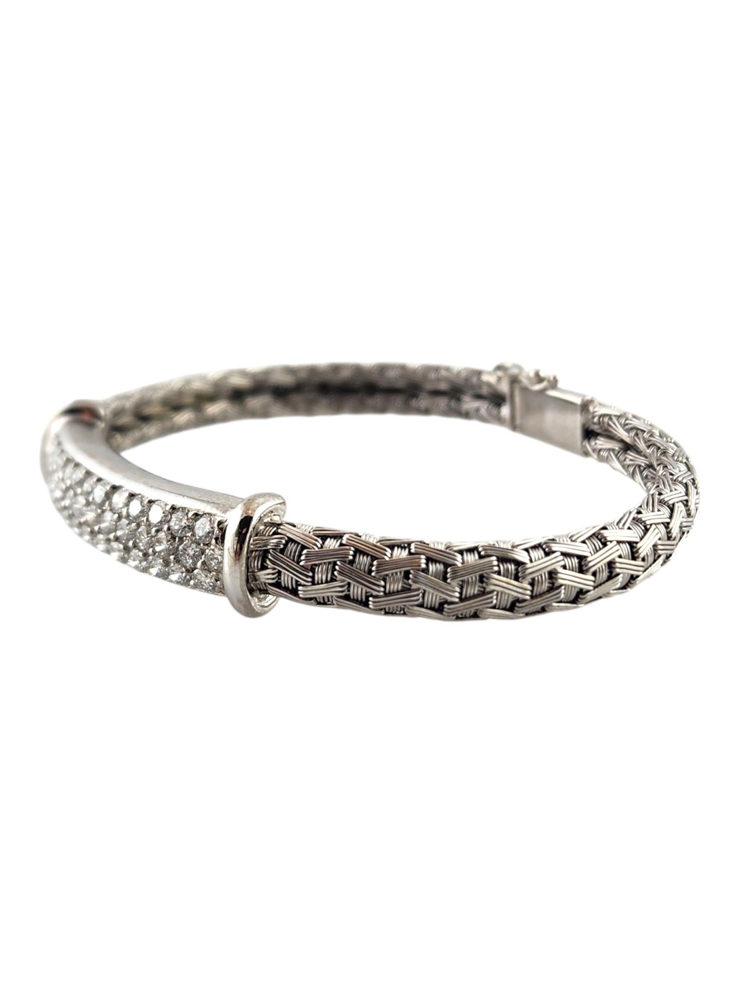 Roberto Coin 18K White Gold Silk Weave Bracelet

This gorgeous silk weave bracelet by designer Roberto Coin was meticulously crafted from 18K white gold for a stunning finish with 40 sparkling round brilliant cut diamonds!

Approximate total diamond