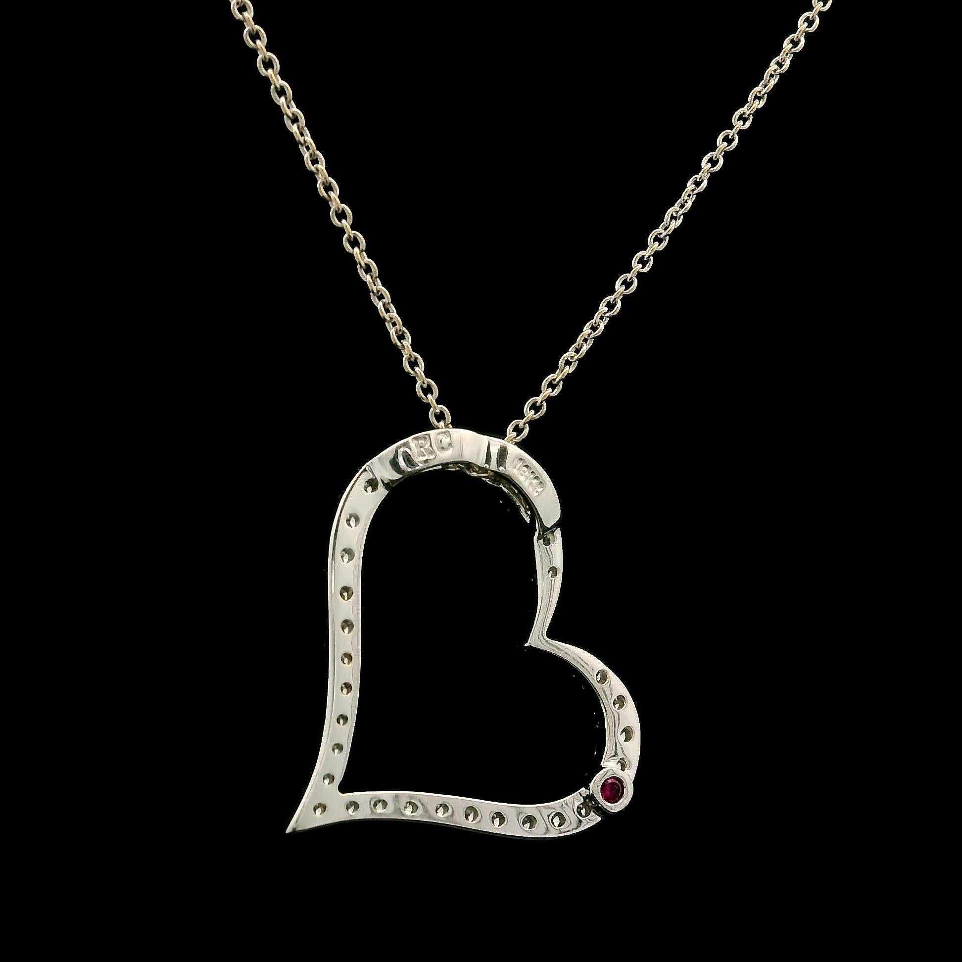 –Stone(s)–
(33) Natural Genuine Diamonds - Round Brilliant Cut - Pave Set - G/H Color - VS1/VS2Clarity
(1) Red Stone - Round Cut - On the Back For Signature

Material: Solid 18k White Gold
Weight: 3.03 Grams
Chain Type: 16” or 18” adjustable - Cable