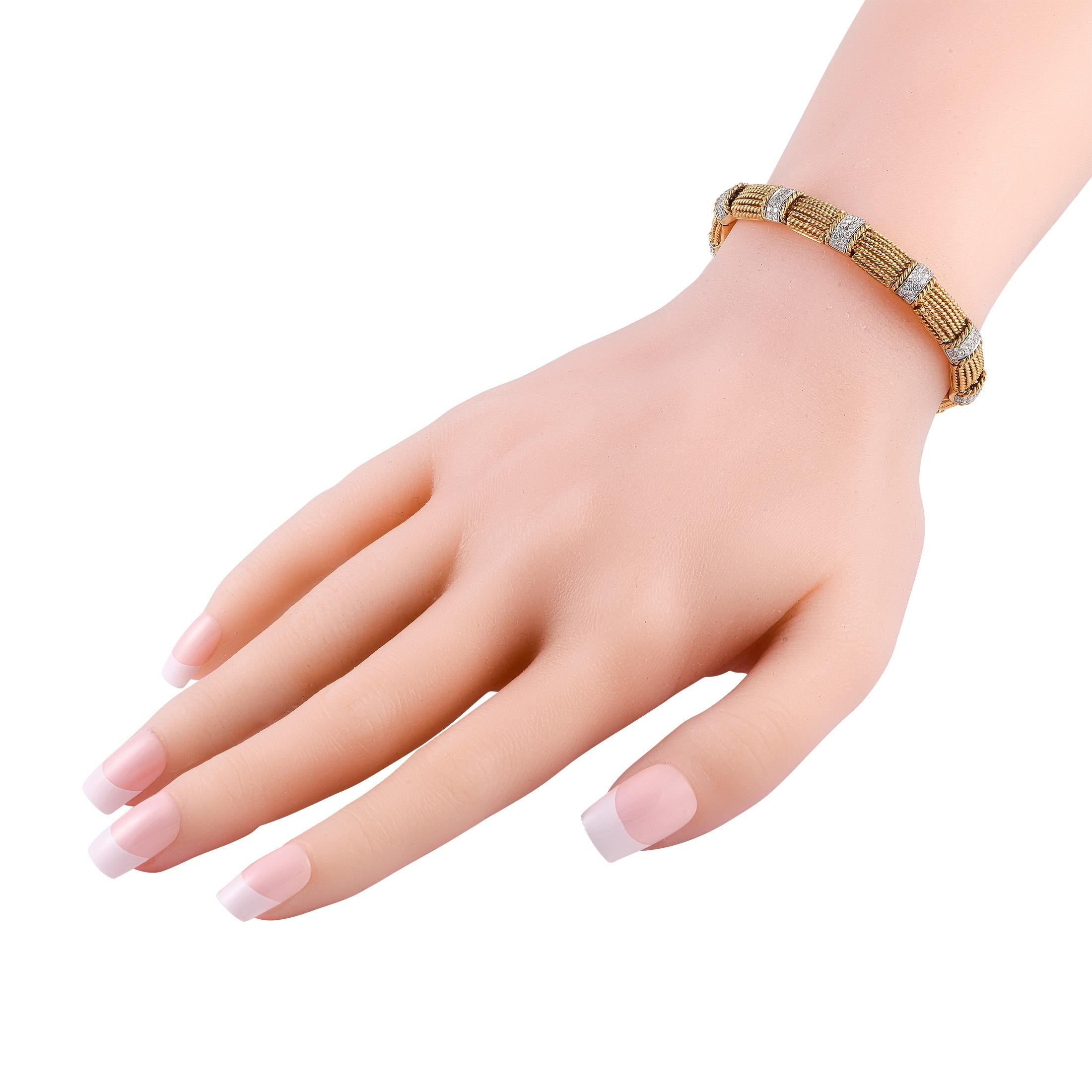 This masterfully designed yellow gold bracelet is a true testament to Roberto Coin's excellent workmanship. The bracelet is designed with multiple rigid rope-textured strands punctuated by diamond-studded collars.This Roberto Coin 18K Yellow Gold