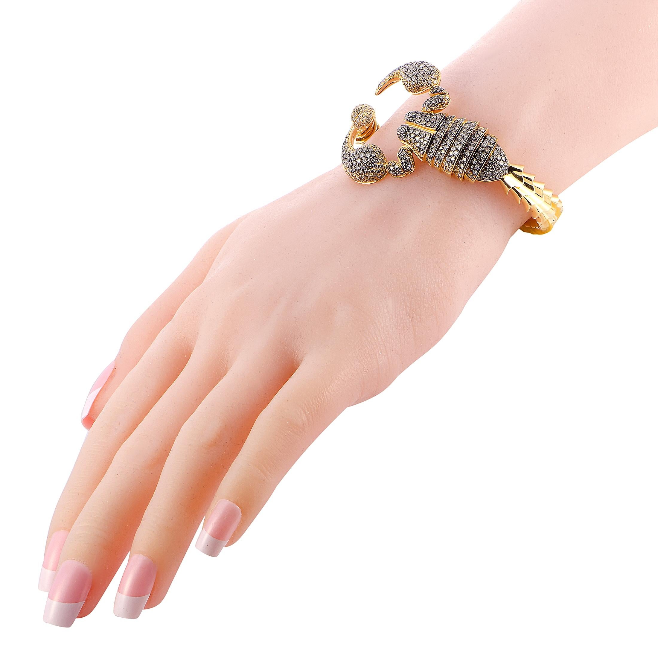 This Roberto Coin bracelet is made out of 18K yellow gold and diamonds that total 4.80 carats. The bracelet weighs 61 grams and measures 7” in length, boasting a 2.25” diameter.

Offered in brand new condition, this jewelry piece includes the