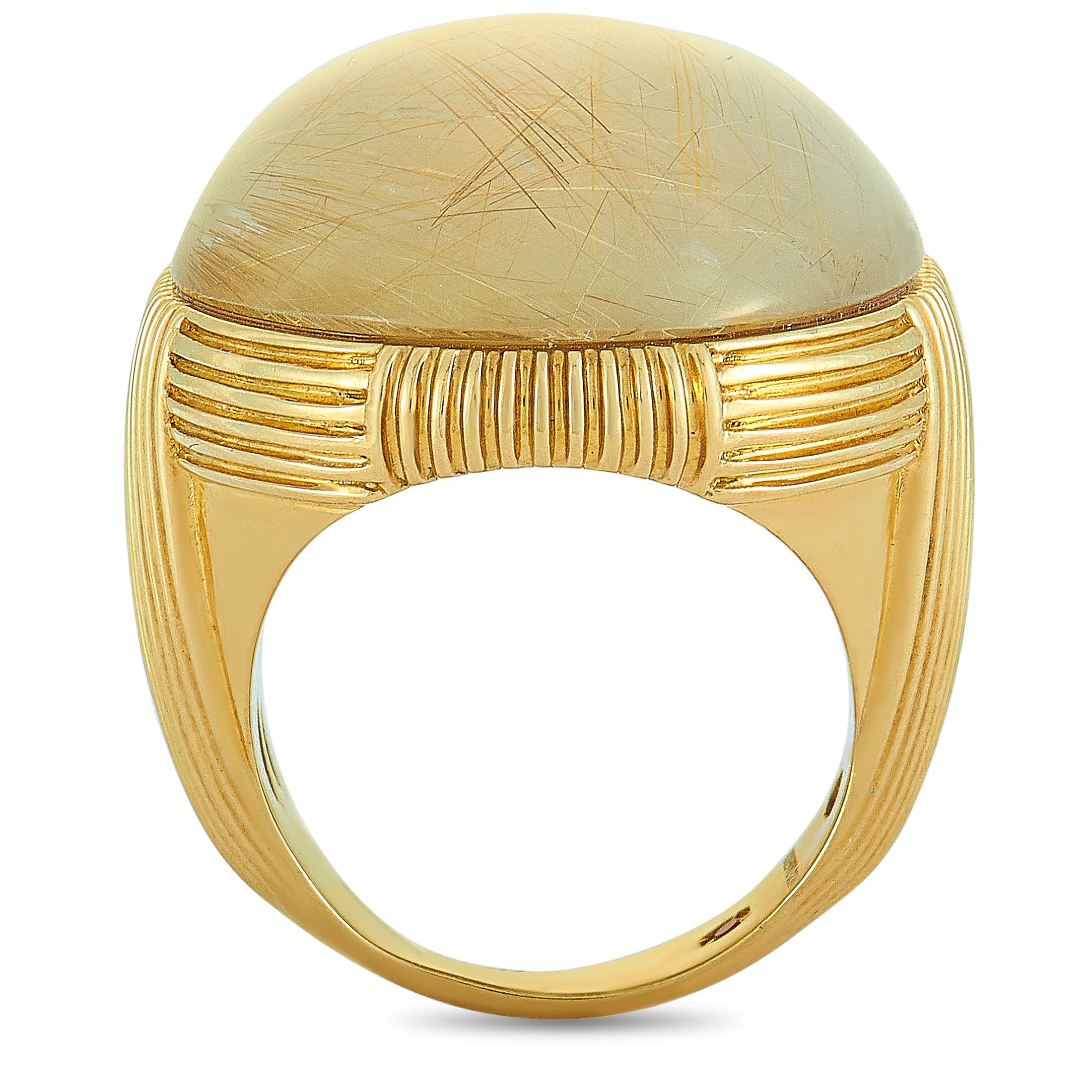 This Roberto Coin ring is crafted from 18K yellow gold and set with a rutilated mother of pearl. The ring weighs 27.5 grams, boasting band thickness of 4 mm and top height of 12 mm, while top dimensions measure 24 by 30 mm.
Ring Size: 7

Offered in