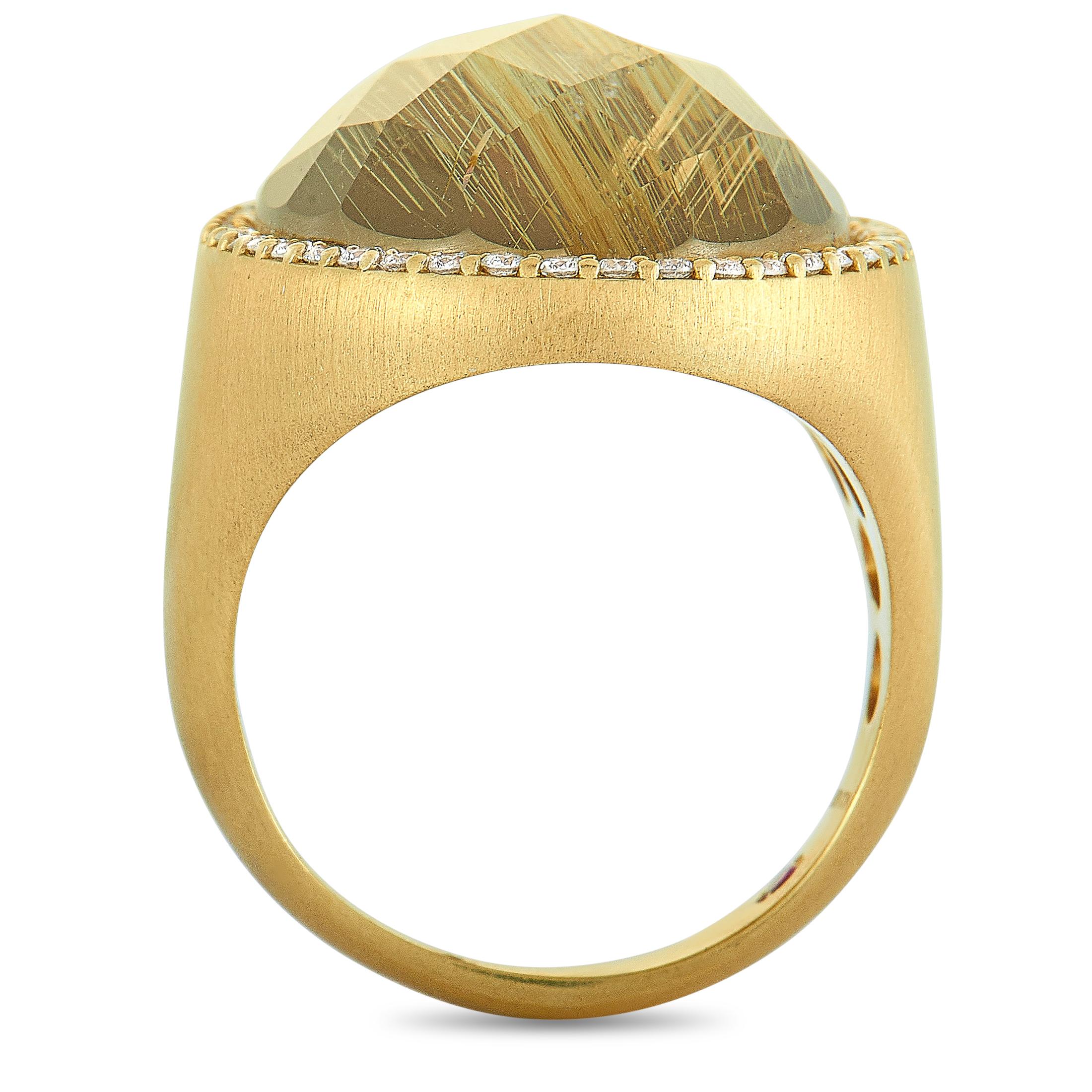 This Roberto Coin ring is crafted from 18K yellow gold and set with a 15.00 ct rutilated quartz and a total of 0.40 carats of diamonds. The ring weighs 15.3 grams, boasting band thickness of 4 mm and top height of 7 mm, while top dimensions measure