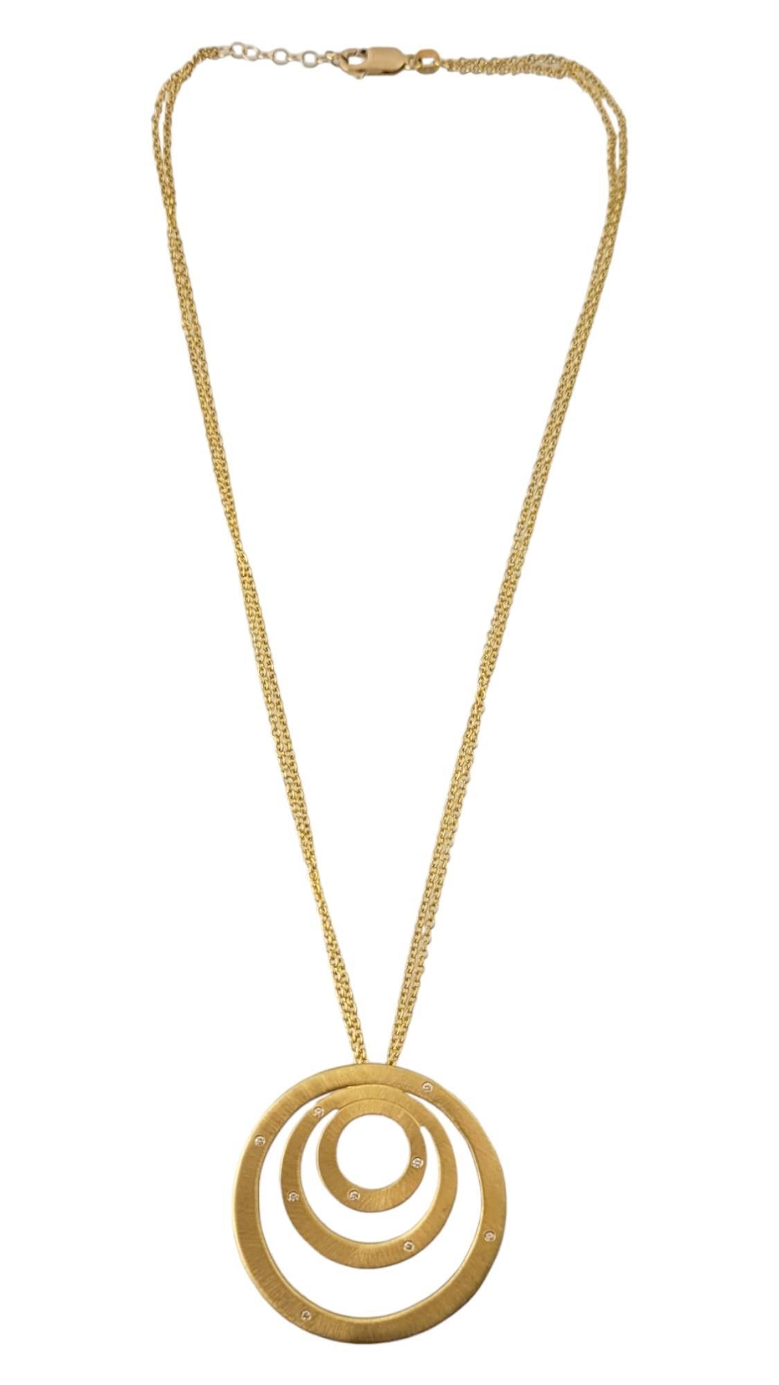 Roberto Coin 18K Yellow Gold Diamond Concentric Circle Pendant Double Chain Necklace 

This gorgeous 18K yellow gold circle pendant features 9 sparkling, round brilliant cut diamonds and is paired with a gorgeous 18K gold double chain!

Approximate