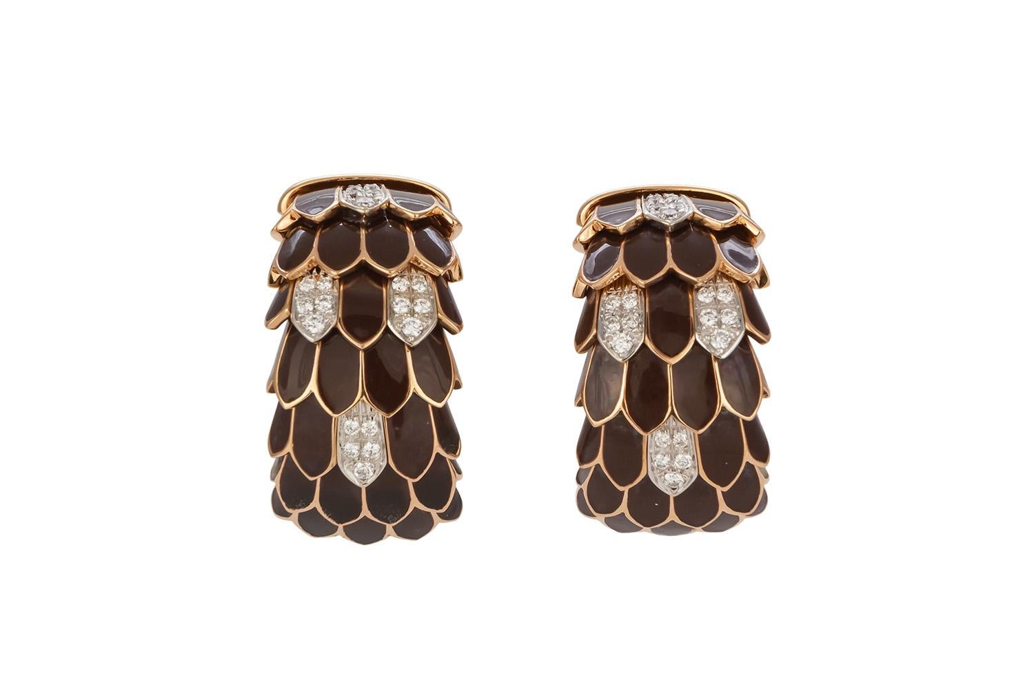 We are pleased to offer these Roberto Coin 18k Yellow Gold Diamond & Enamel Animalier Feather Huggie Earrings. These finely crafted earrings feature a feather or scale motif with dark brown enamel and an estimated 0.66ctw F-G/VVS-VS round brilliant