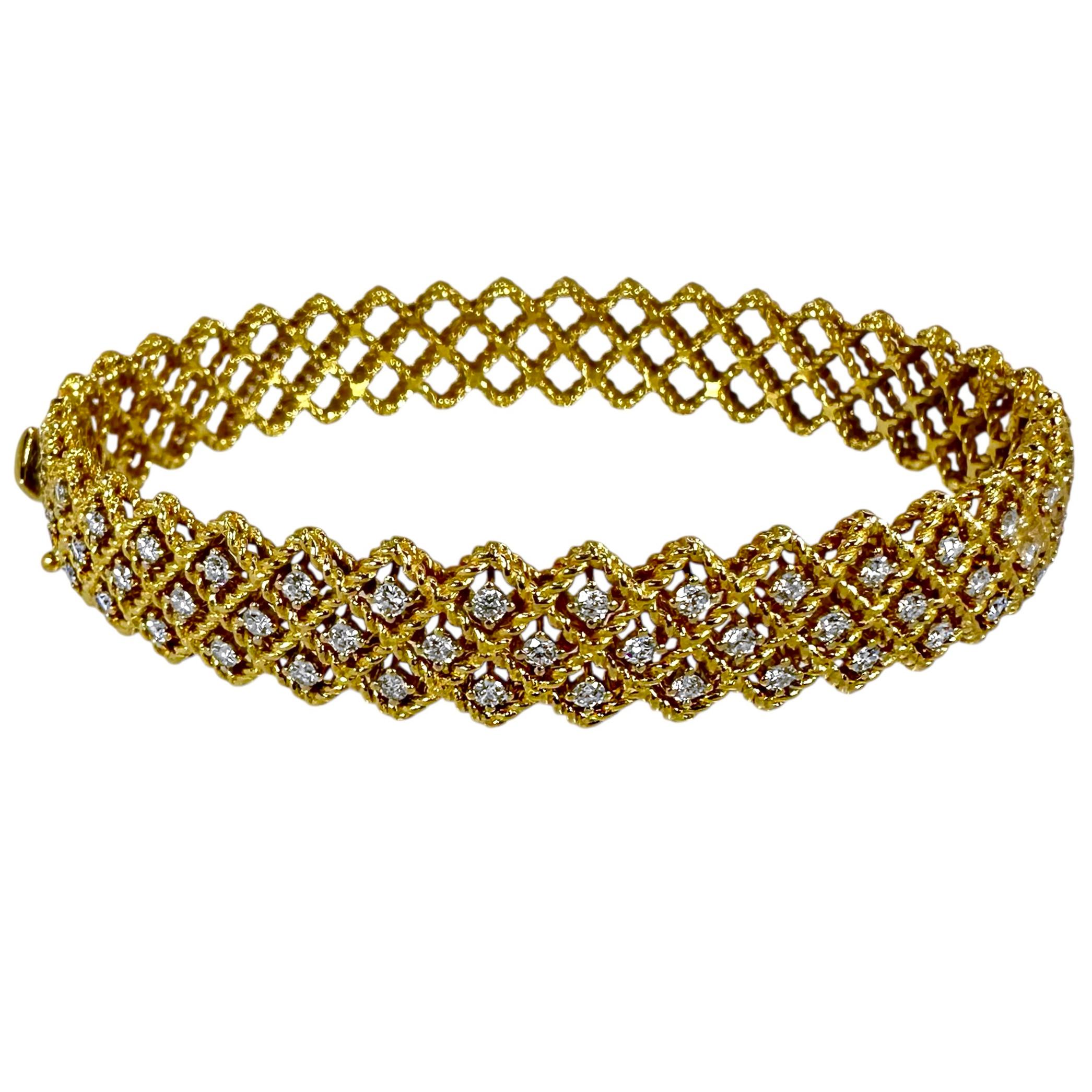 This tailored, oval shape, Roberto Coin vintage bracelet, is an exquisite creation of twisted 18K yellow gold rope and fine quality modern brilliant cut diamonds. Fifty diamonds are set across the top and appear to be floating in square spaces