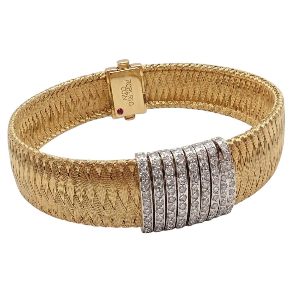 Pulsera tipo brazalete de Roberto Coin en oro amarillo de 18k con diseño «Silk Weave» y diamantes en venta