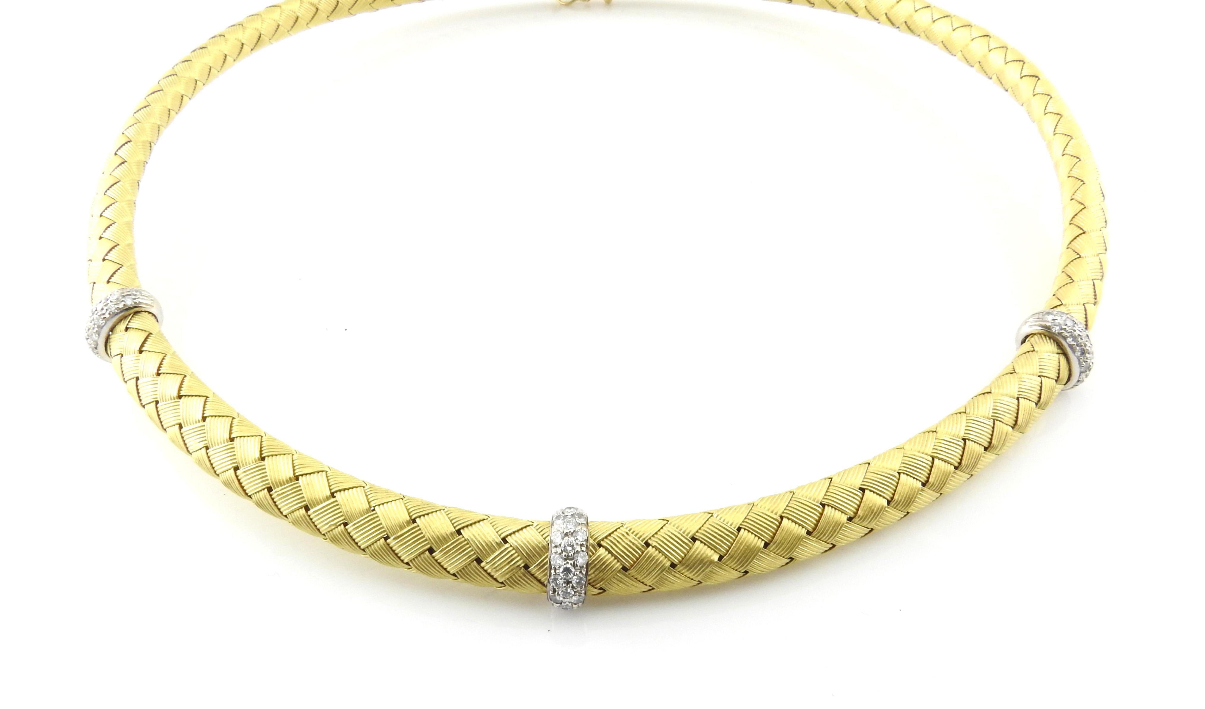 Roberto Coin 18K Yellow Gold and Woven Silk Diamond Necklace

This gorgeous Roberto Coin choker is set in 18K yellow gold and woven silk.

Three stations of diamonds total approx. .48cts. Diamonds are round brilliant cut and of VS clarity, G