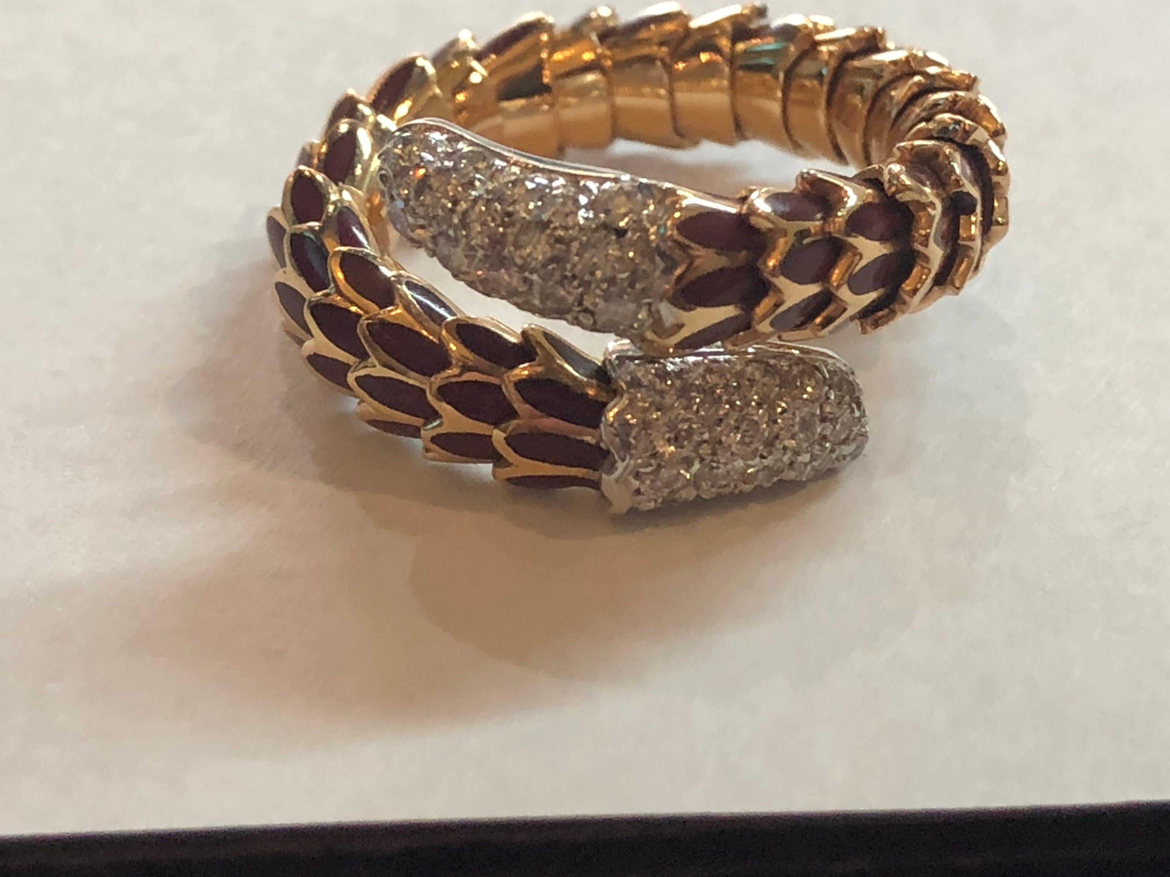 Roberto Coin 40 Diamond Enamel 18K Rose Gold Snake Design Ring
Size 5.5 and it is flexible so it can be worn on multiple fingers
40 diamons that Are VS in clarity and F-G in Color 
.40 ct total diamond weight
18k Rose Gold weighing 11.0
