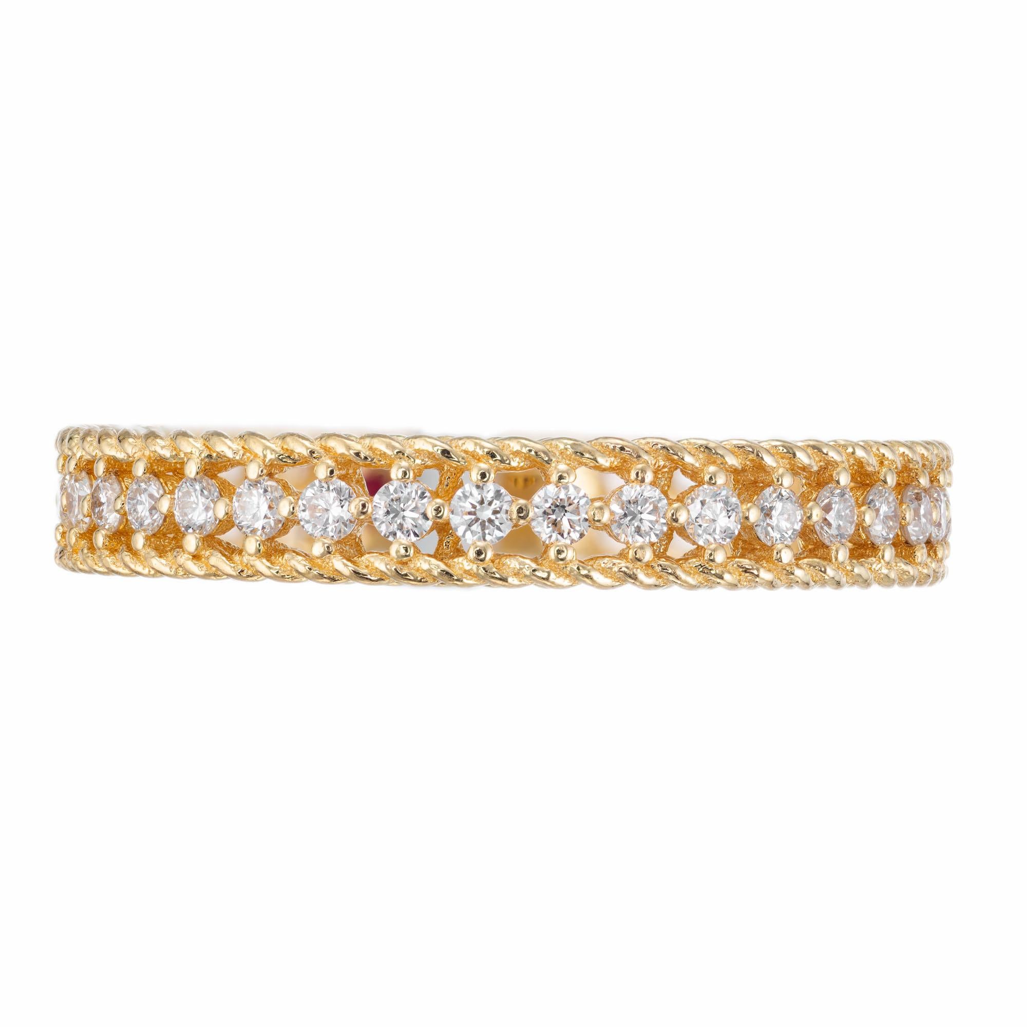 Roberto Coin symphony princess diamond eternity band. Round brilliant cut diamonds set in 18k yellow gold.

36 round brilliant cut diamonds G-H, VS approx. .43ct
1 round red ruby, approx. .2ct
Size 6.5 – not sizable
18k yellow gold 
Stamped: