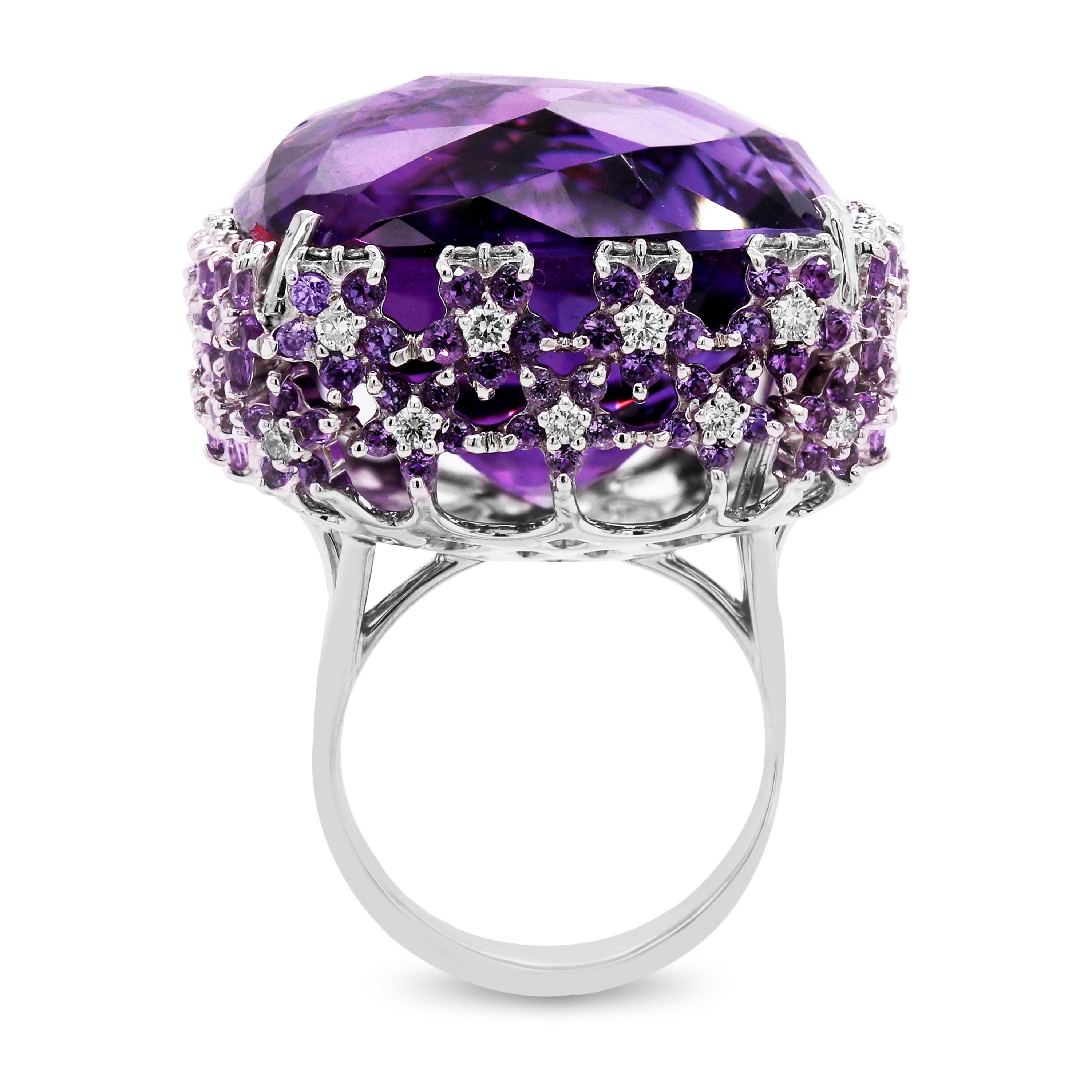 Roberto Coin 73.44 Carat Amethyst 18K White Gold Diamond Large Cocktail Ring

This incredible ring features a large 73.44 carat Amethyst center with Diamonds and Amethyst throughout the ring set in solid 18K Gold.

This ring has melee diamonds and