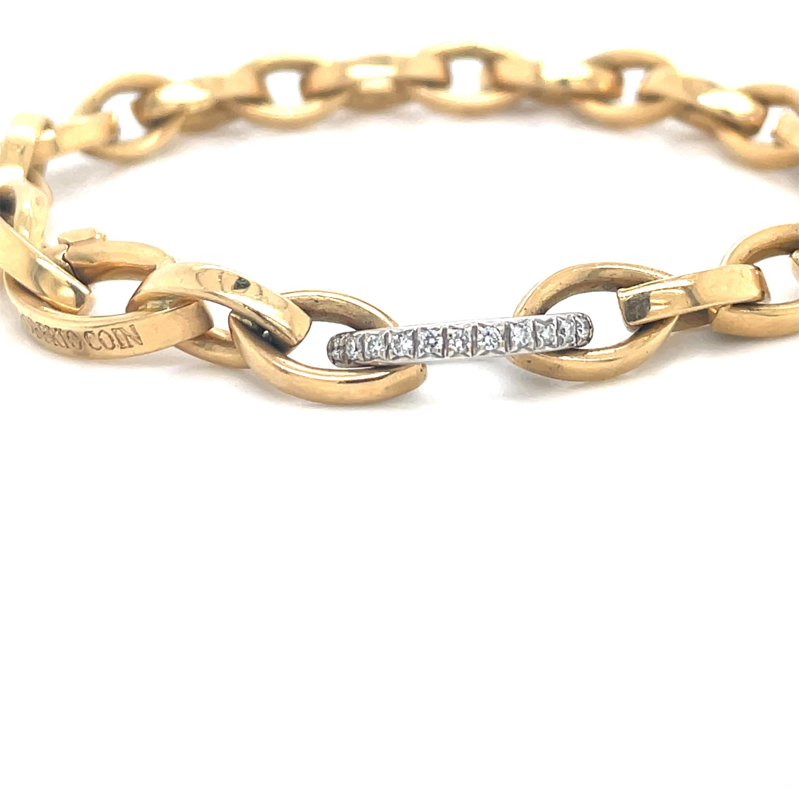 Roberto Coin 'Almond' bracelet featuring 22 gold links and one diamond link with the signature Red Ruby. 