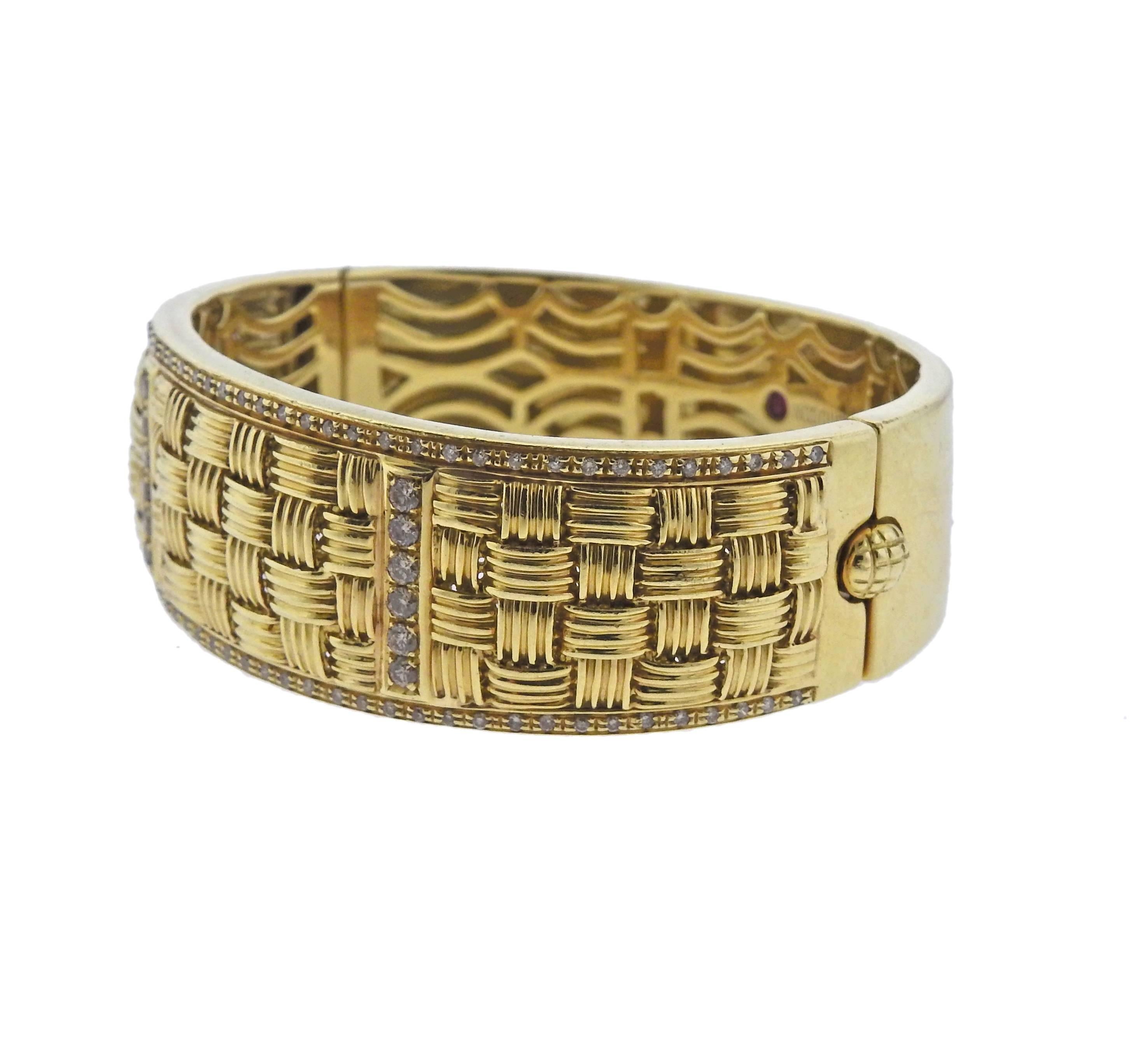 18k yellow gold Appassionata bangle bracelet, crafted by Roberto Coin, decorated with approx. 0.70ctw in G/VS diamonds . Bracelet will fit approx. 7