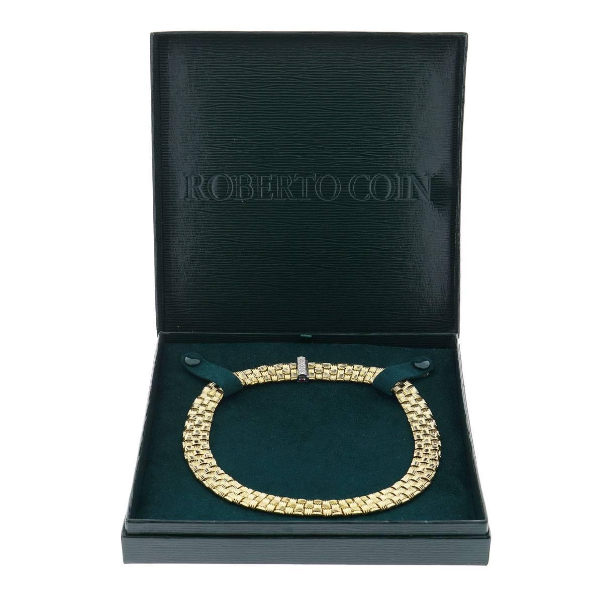 Roberto Coin Appasionata Collection necklace. The necklace is 16 inches in length, made of 18K yellow gold, and weighs 73.5 DWT (approx. 114.31 grams). It also has 19 round G-color, VS-clarity diamonds weighing 0.20 CTTW, two baguette rubies, and