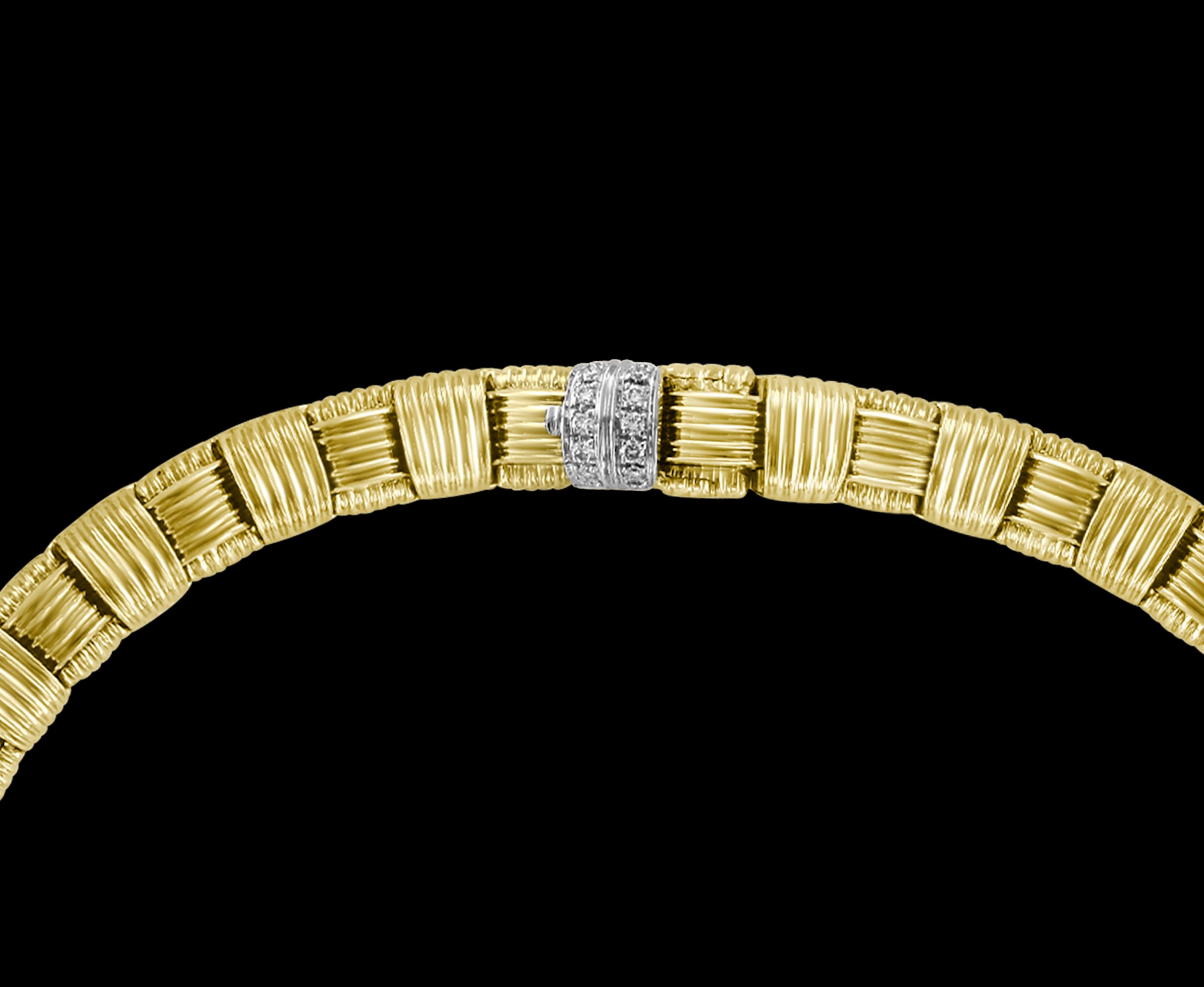 A statement of true, classic elegance, this 18k Roberto Coin Appasionata Necklace with Pave Diamond Clasp (.16ctw), is from his signature collection. The interlocking ribbed gold links, in a lovely basket-weave, provide flexibility with a