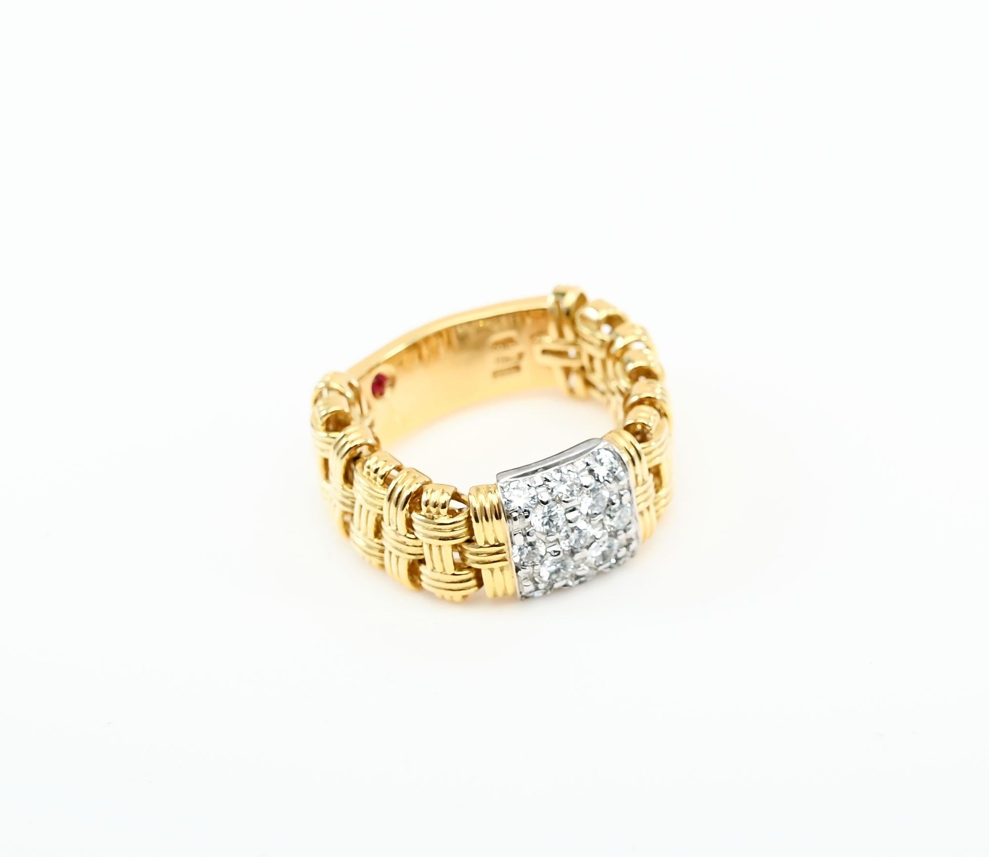 Two features make this Roberto Coin Appassionatta band ring unusual. The center has a panel of 12 round brilliant diamonds. In addition, the ring is flexible making it easy to put on for anyone with enlarged knuckles. The ring is size 7 3/4. Size