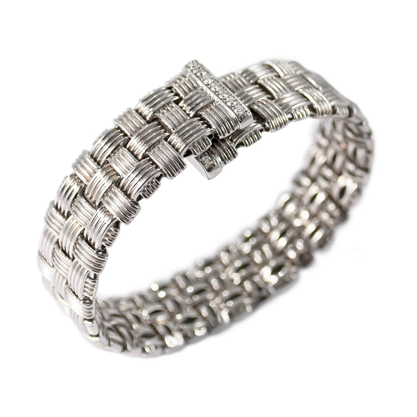 This iconic bracelet from the Roberto Coin Appassionata Collection is made in 18K White Gold with diamond pavé accents, and the interior is set with a signature red ruby detail inherent to the Italian designer. Flexible movement allows you to style